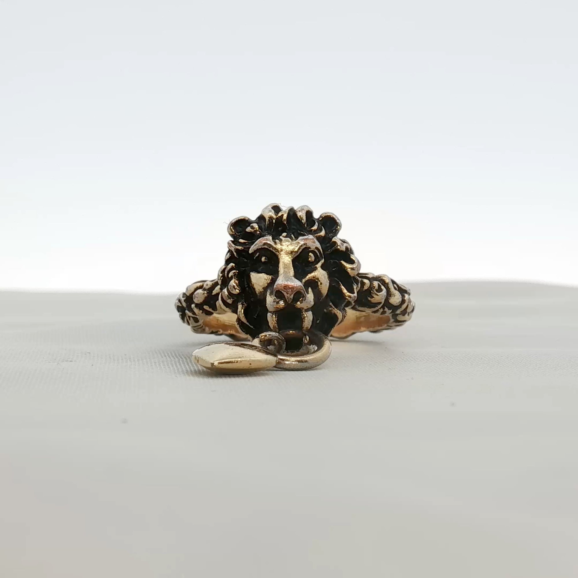 Gold & Beyond Gucci Lion Head with Heart jewelry ring featuring detailed lion and heart design in gold.