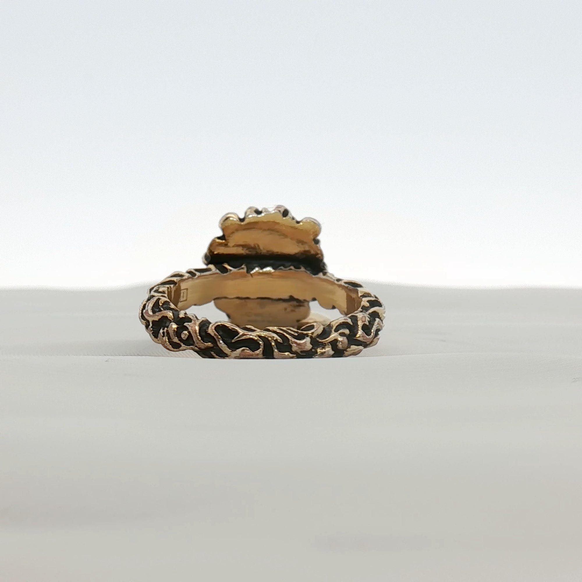 Gold & Beyond Gucci Lion Head with Heart jewelry ring featuring a detailed lion face and heart design in gold-tone metal.