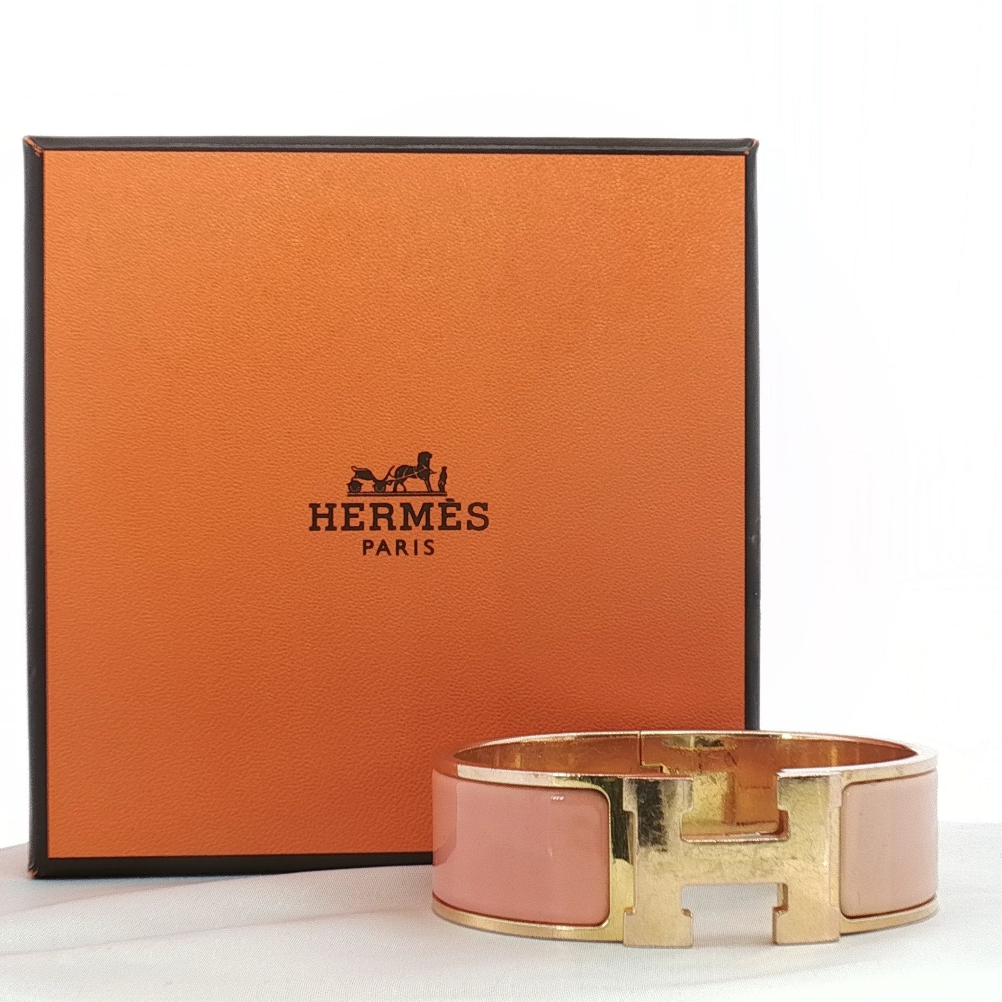 Hermès Wide H bracelet from Gold & Beyond jewelry collection, featuring a sleek gold H-shaped design on a smooth band.