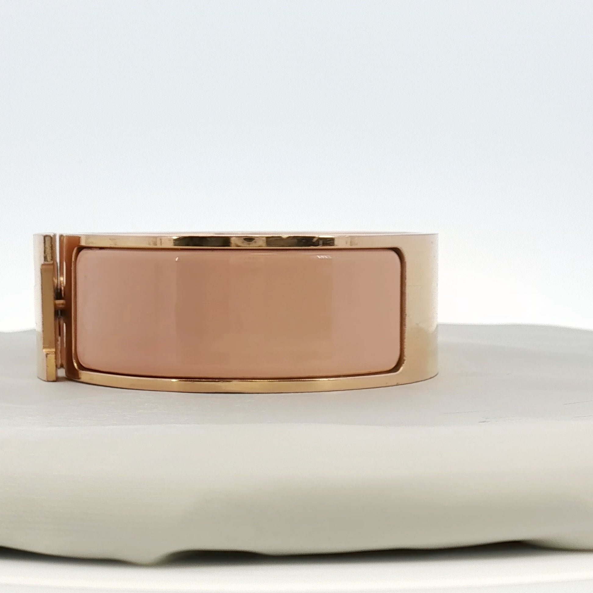Hermès Wide H bracelet by Gold & Beyond, a stylish gold jewelry piece featuring the iconic H design on a sleek bracelet.