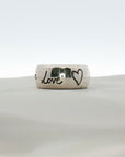 Gucci Blind for Love sterling silver ring with engraved motif band, size 6, displayed on a neutral background.