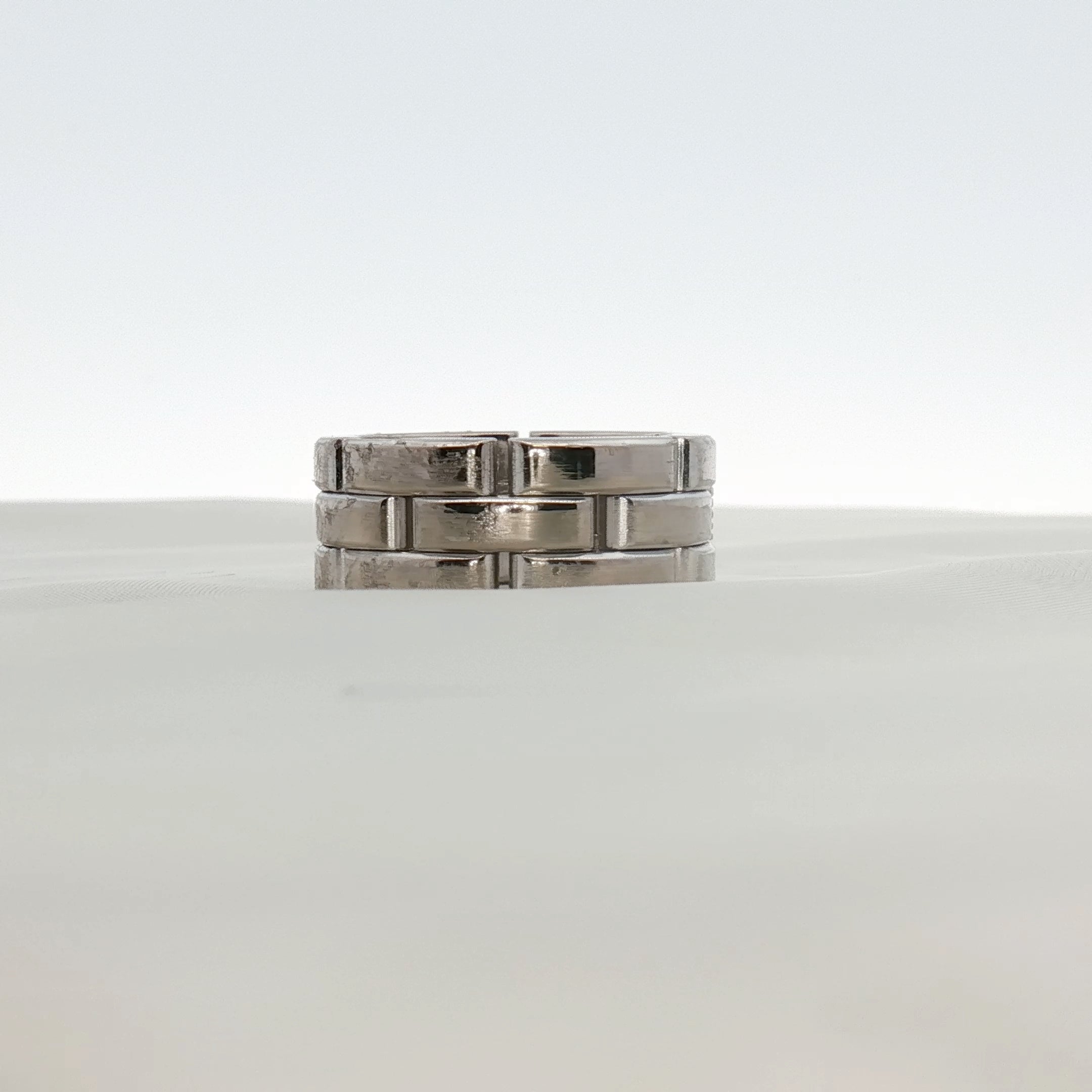 Cartier Maillon diamond ring featuring gold and diamond accents, showcasing elegant jewelry design.