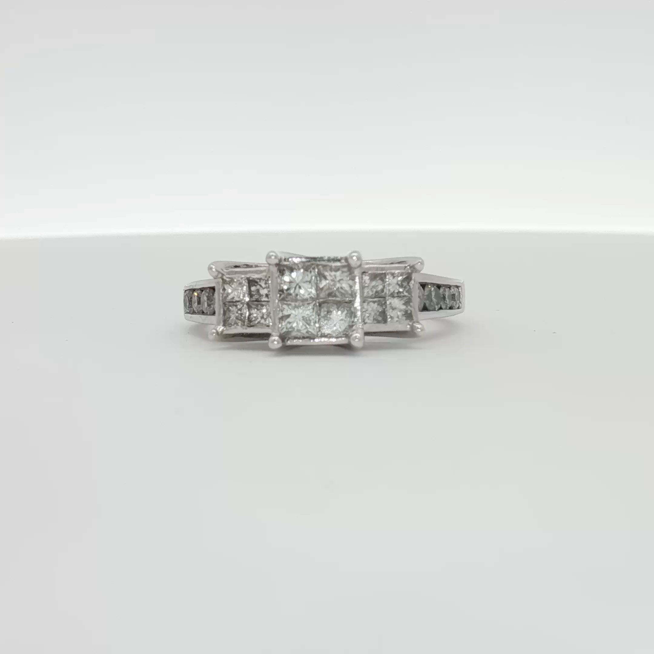 14K white gold diamond cluster ring featuring sparkling diamonds arranged in a elegant jewelry design.