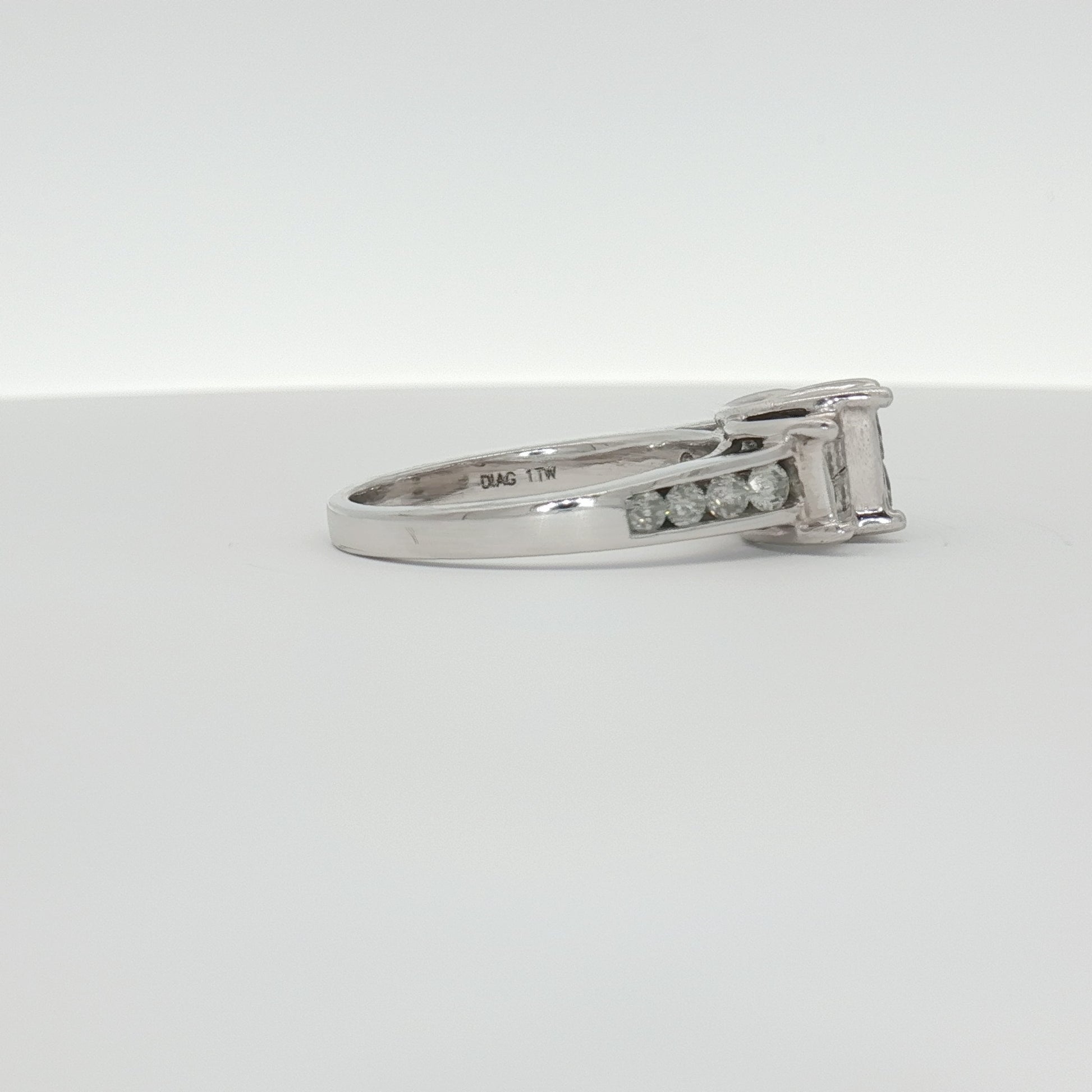 14K white gold diamond cluster ring with sparkling stones, showcasing intricate design and elegant craftsmanship.