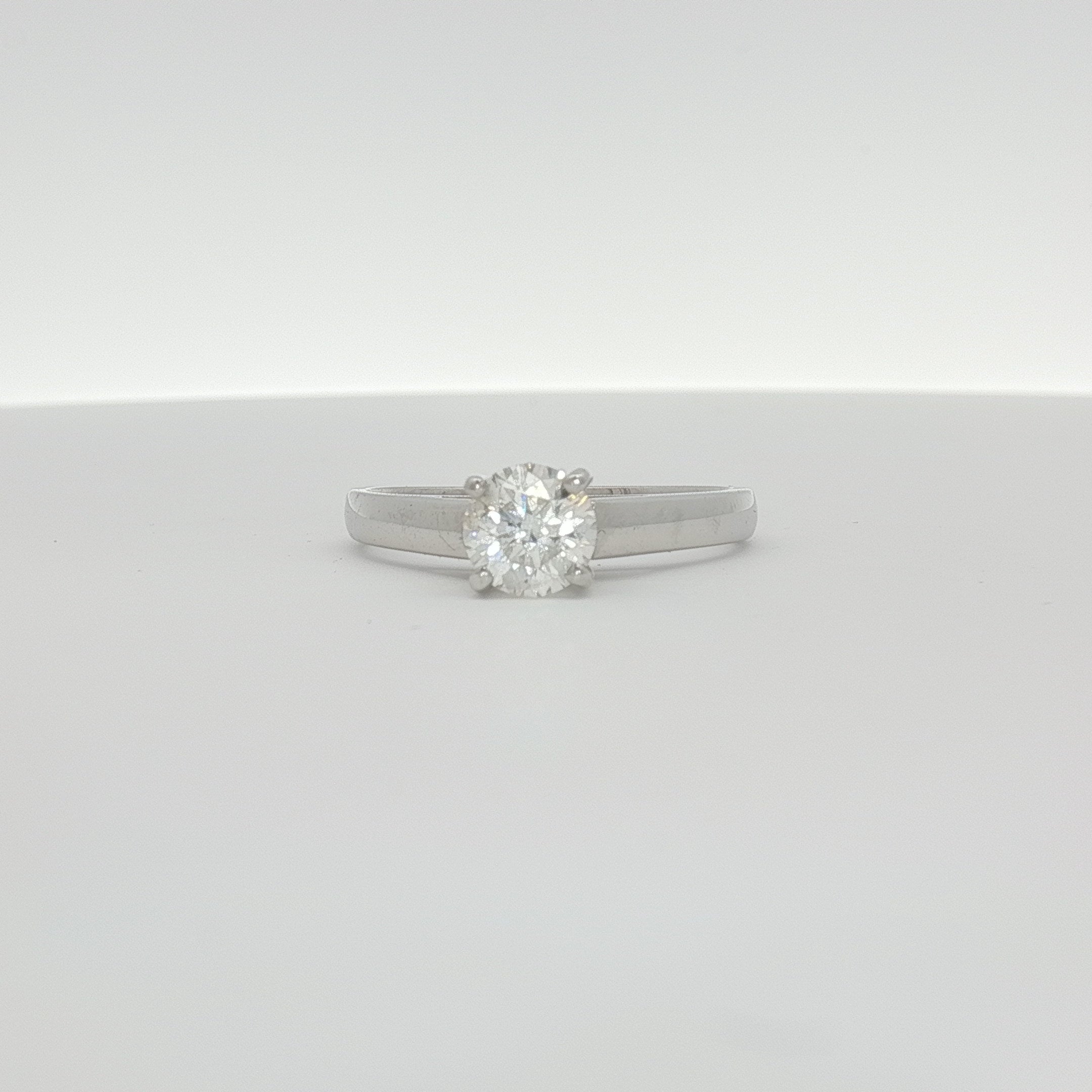 14K white gold diamond solitaire ring featuring a single sparkling diamond, elegant jewelry piece by Gold & Beyond.