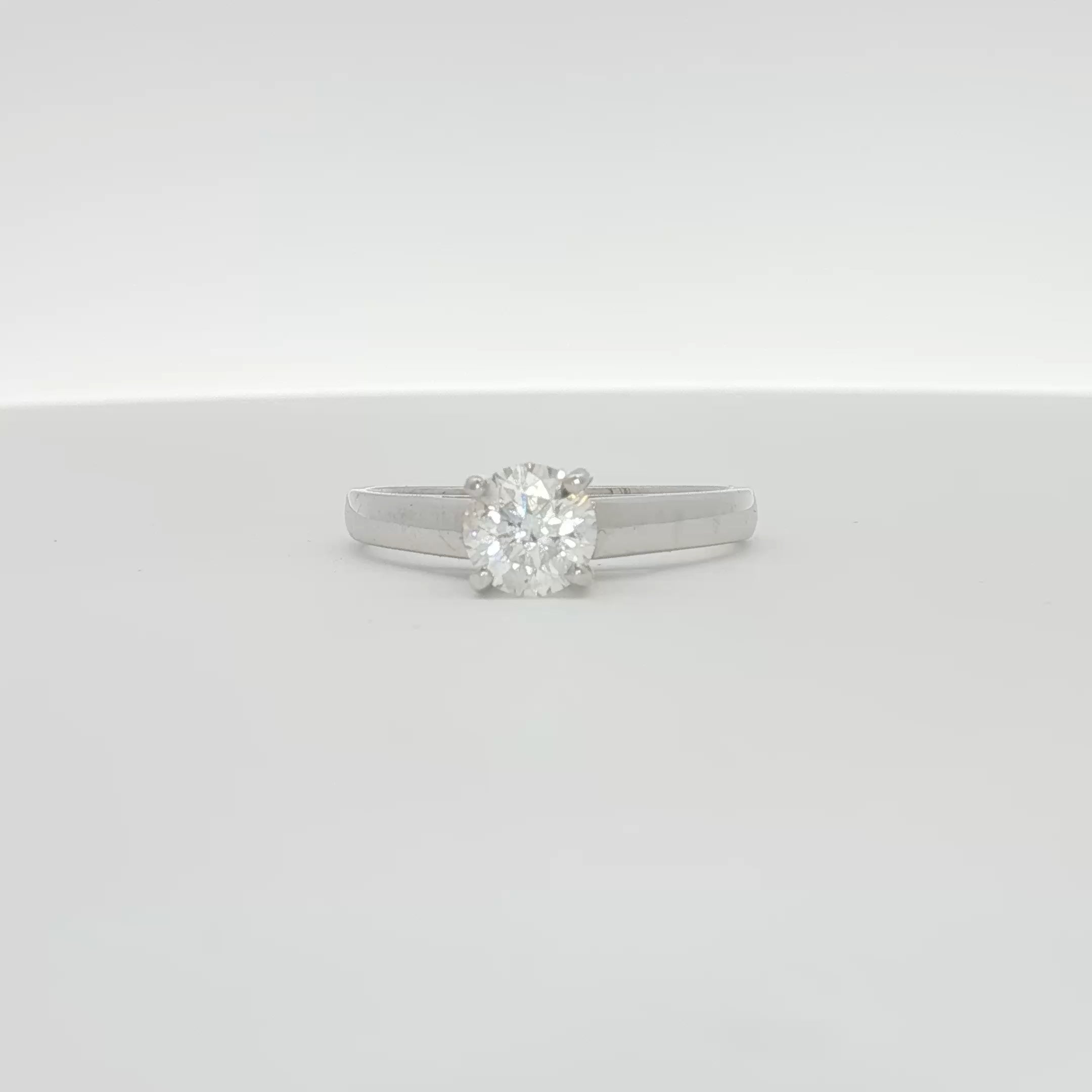 14K white gold diamond solitaire ring with a central sparkling diamond, elegant jewelry piece from Gold & Beyond.