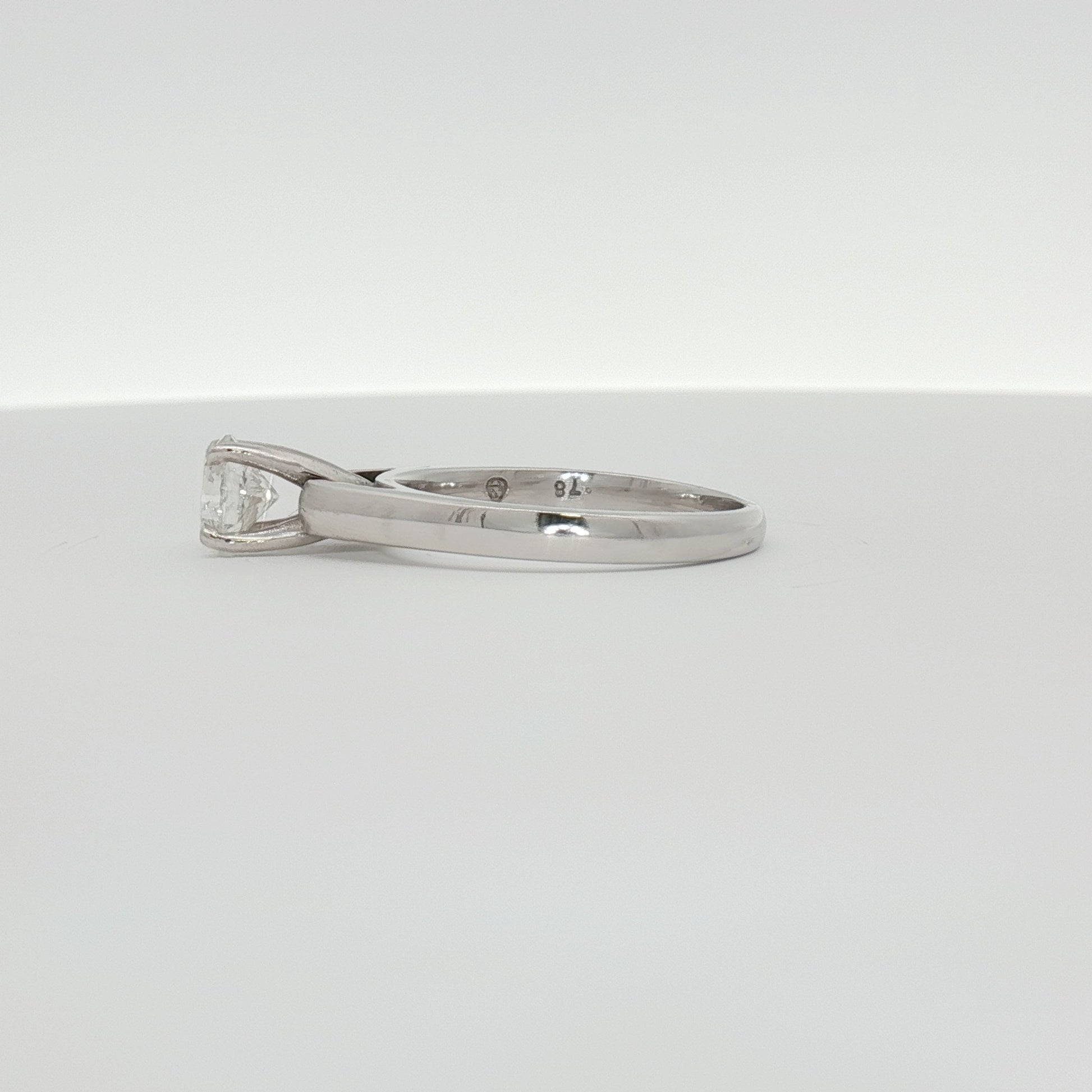 14K white gold diamond solitaire ring featuring a sparkling central diamond, elegant jewelry piece by Gold & Beyond.