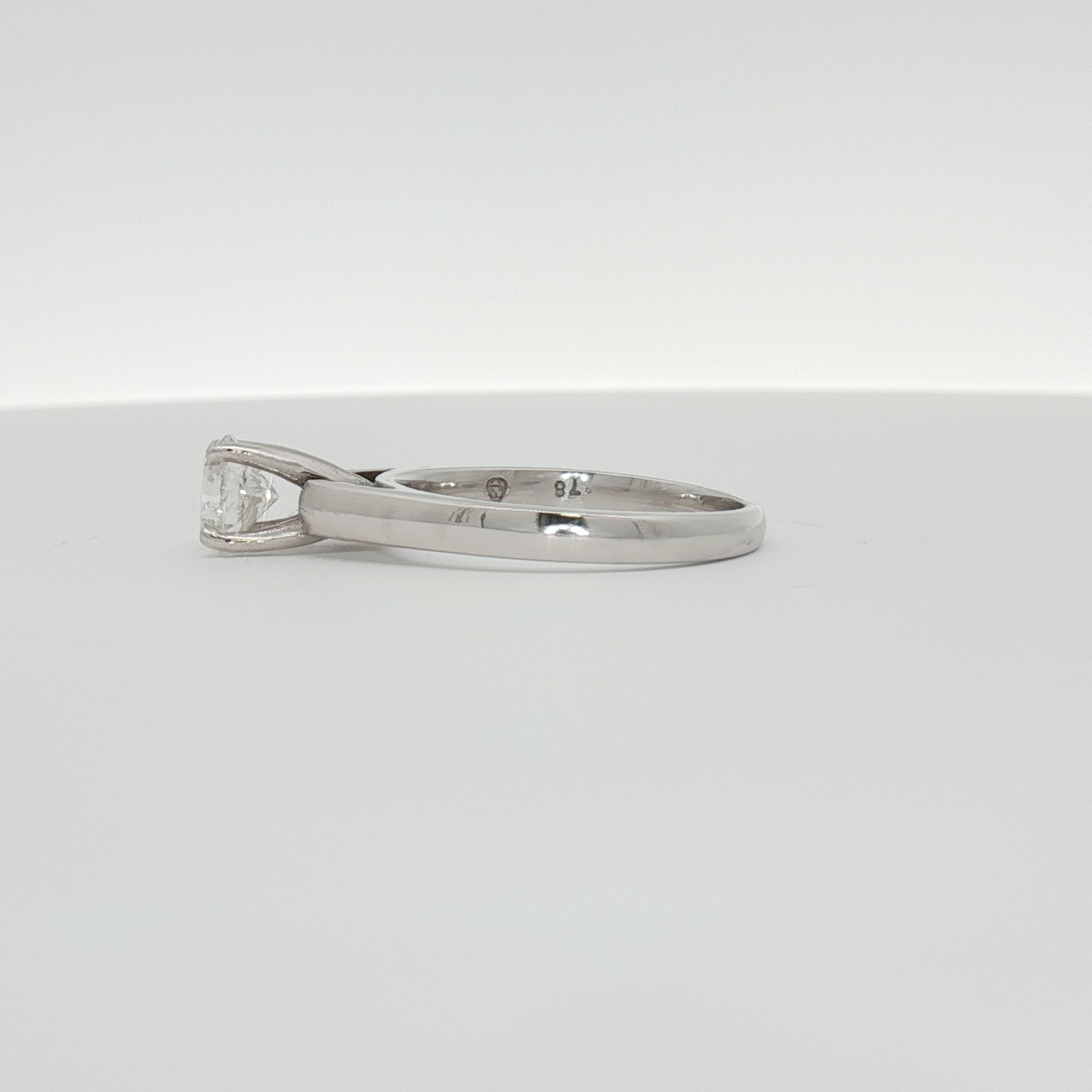 14K white gold diamond solitaire ring featuring a sparkling central diamond, elegant jewelry piece by Gold & Beyond.