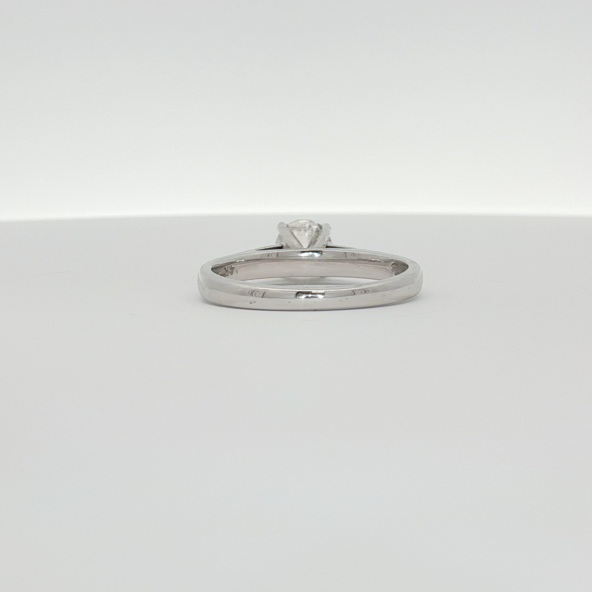 14K white gold diamond solitaire ring featuring a central sparkling diamond, elegant jewelry piece by Gold & Beyond.