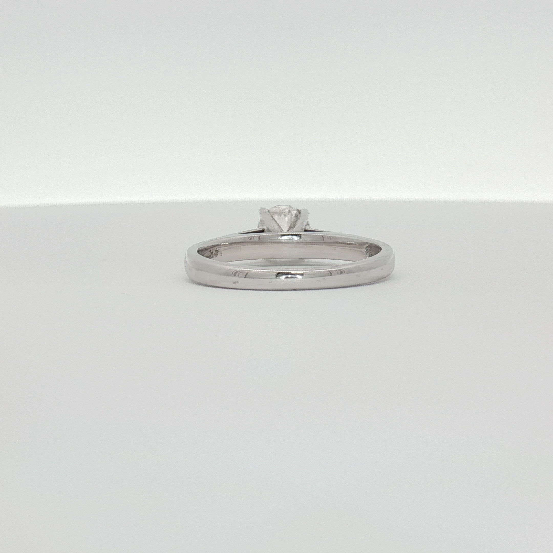 14K white gold diamond solitaire ring featuring a central sparkling diamond, elegant jewelry piece by Gold & Beyond.
