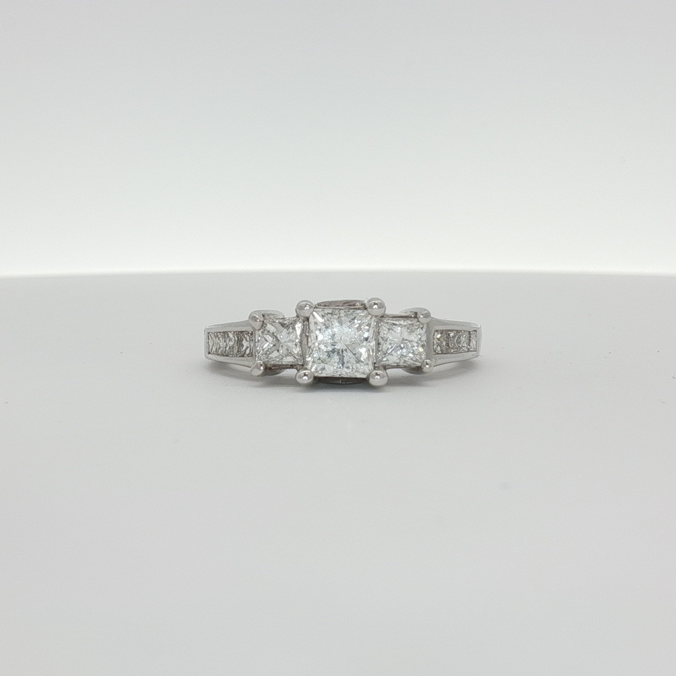 14K white gold diamond cluster ring featuring a sparkling arrangement of diamonds in a jewelry design.