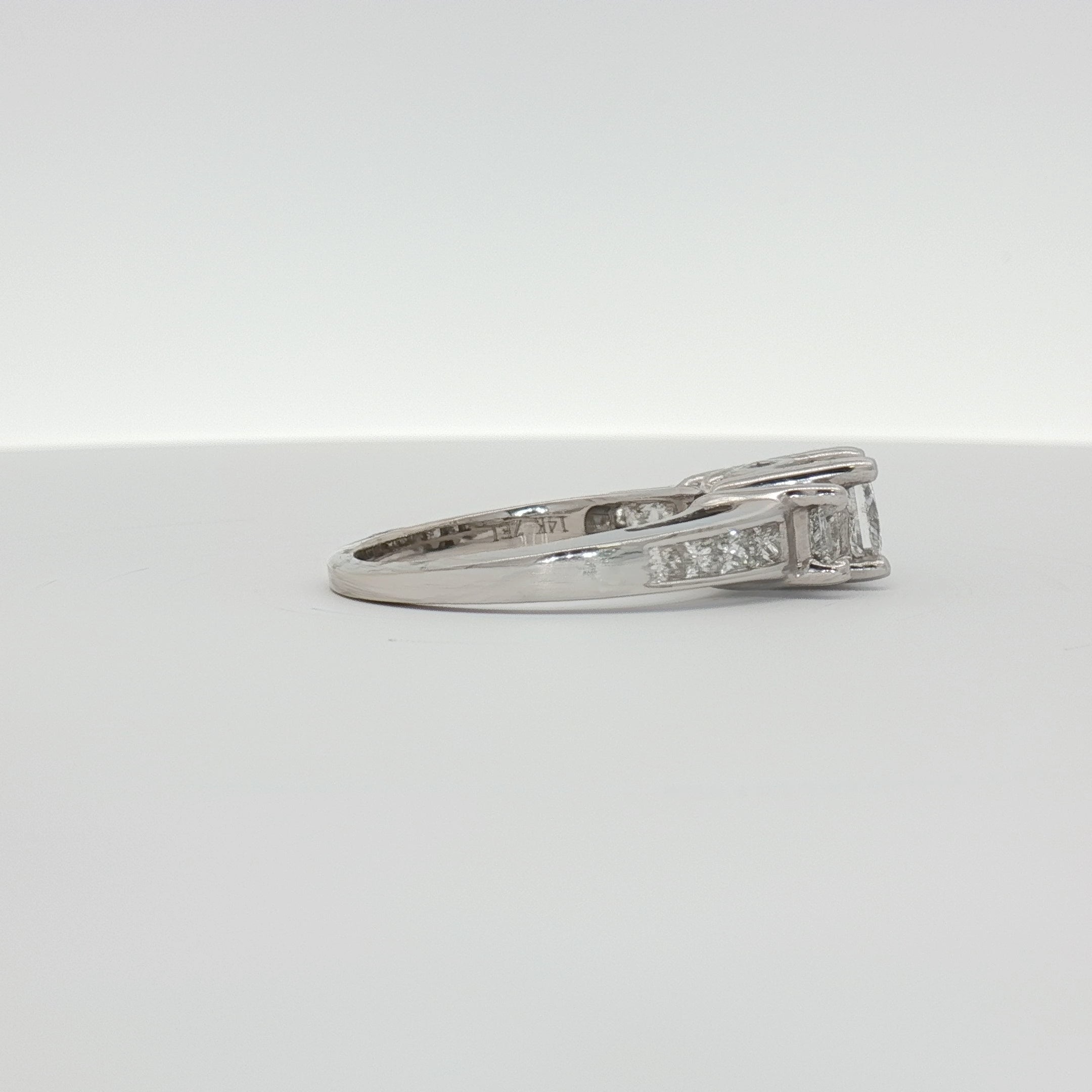 14K white gold diamond cluster ring featuring a sparkling arrangement of small diamonds in elegant jewelry style.