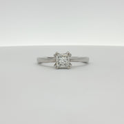 Platinum diamond solitaire engagement ring by Gold & Beyond with a sparkling central diamond and sleek band design.