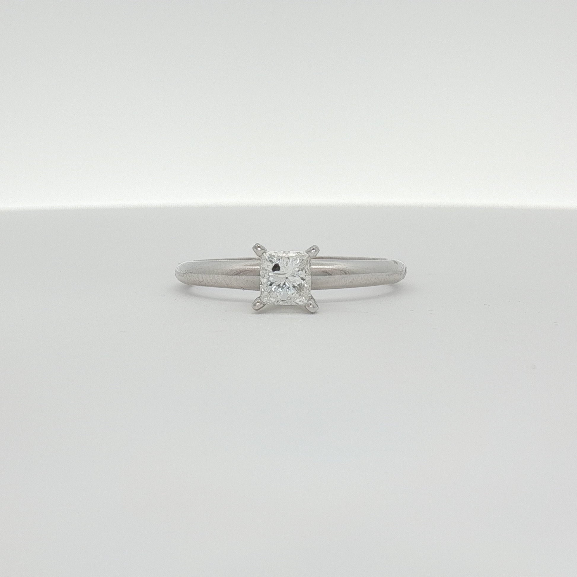 14K white gold diamond solitaire engagement ring with a central sparkling diamond and elegant band from Gold & Beyond.