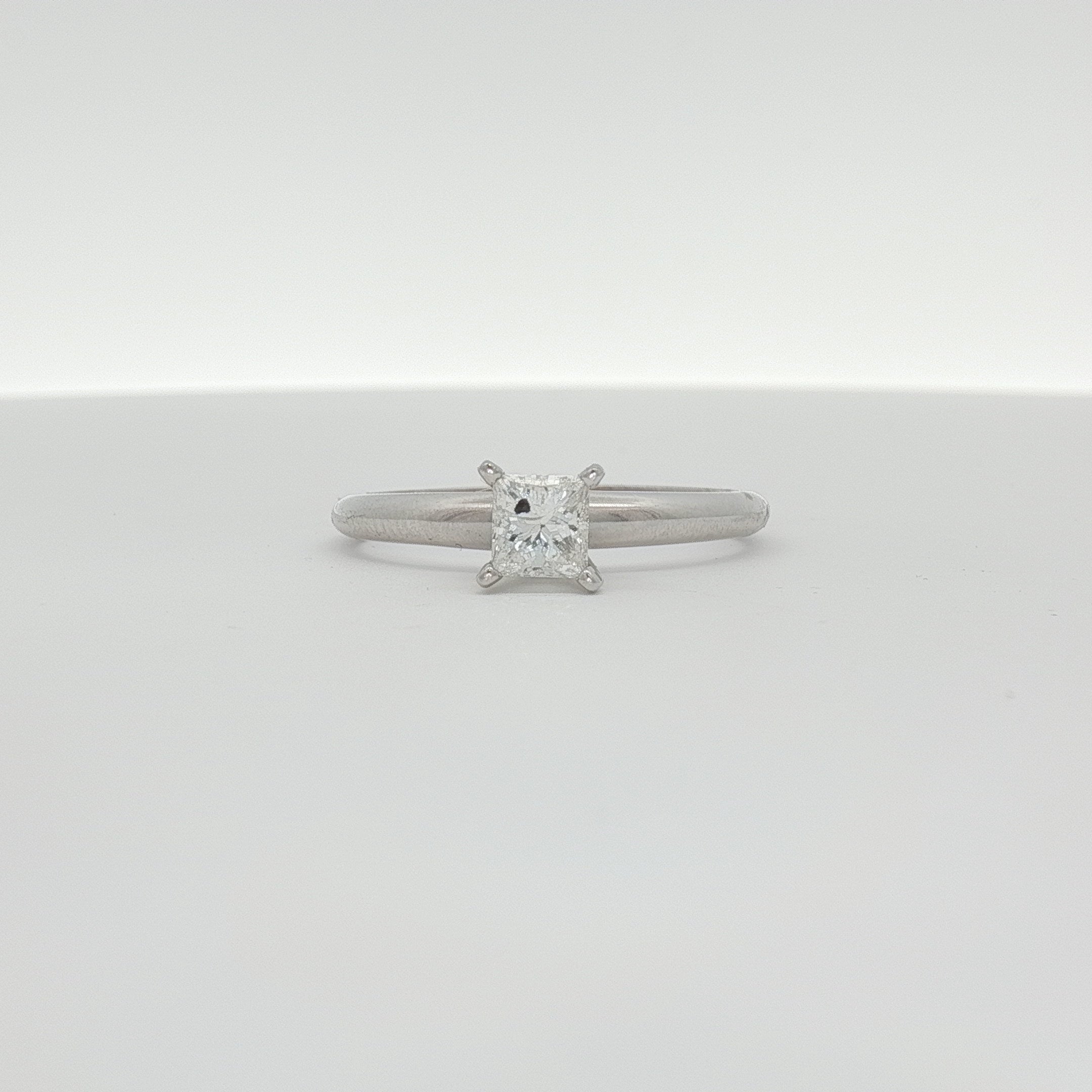 14K white gold diamond solitaire engagement ring with a central sparkling diamond and elegant band from Gold & Beyond.