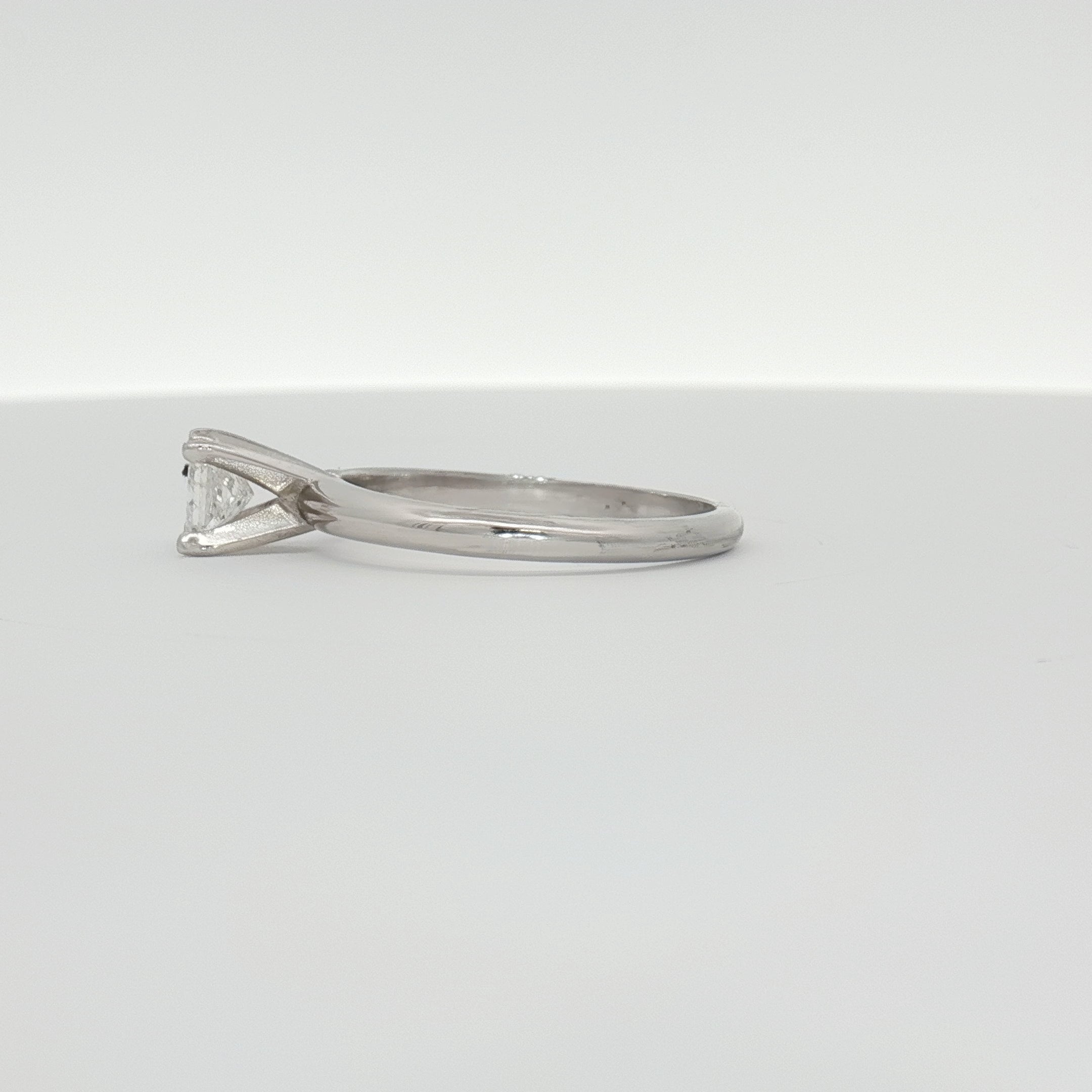 14K white gold diamond solitaire engagement ring with a central sparkling diamond and elegant band from Gold & Beyond.