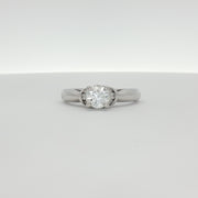 14K white gold diamond solitaire engagement ring featuring a central sparkling diamond and elegant band design.