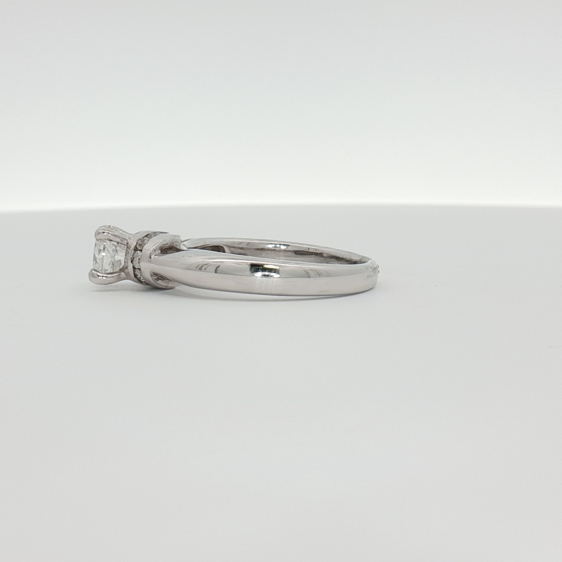 14K white gold diamond solitaire engagement ring with a central sparkling diamond, from Gold & Beyond jewelry collection.
