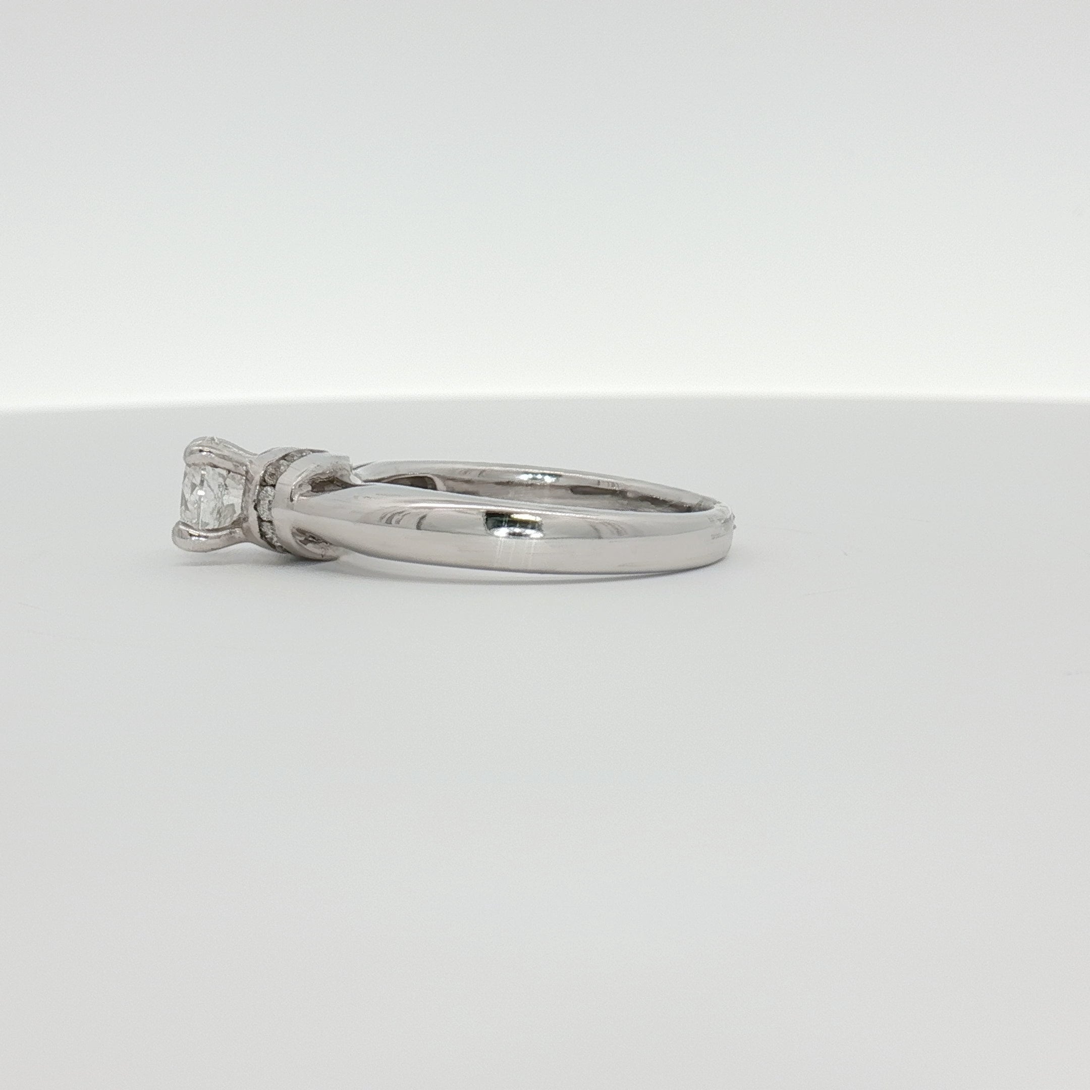 14K white gold diamond solitaire engagement ring with a central sparkling diamond, from Gold & Beyond jewelry collection.