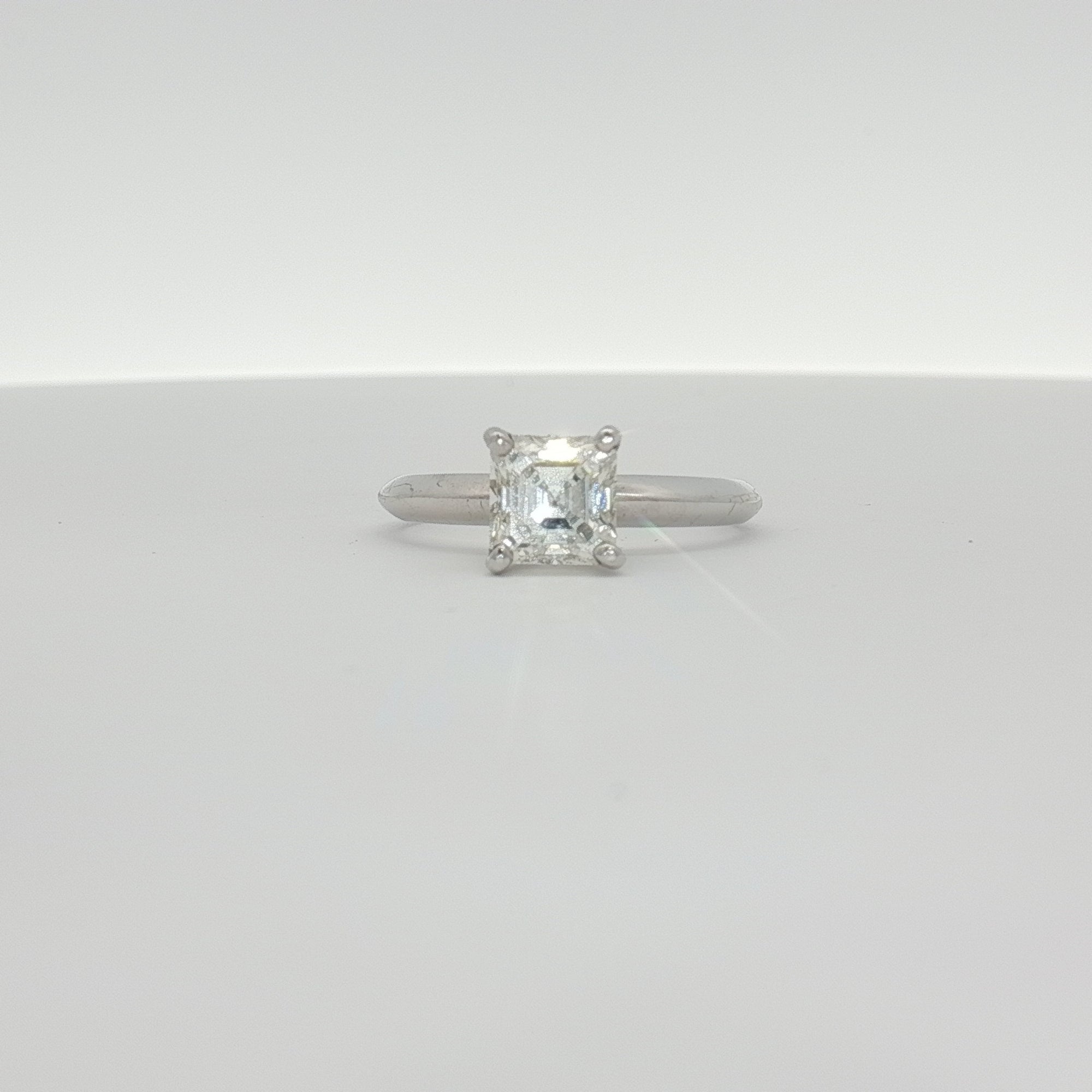 14K white gold diamond solitaire engagement ring with a sparkling center diamond and elegant band, from Gold & Beyond Jewelry.