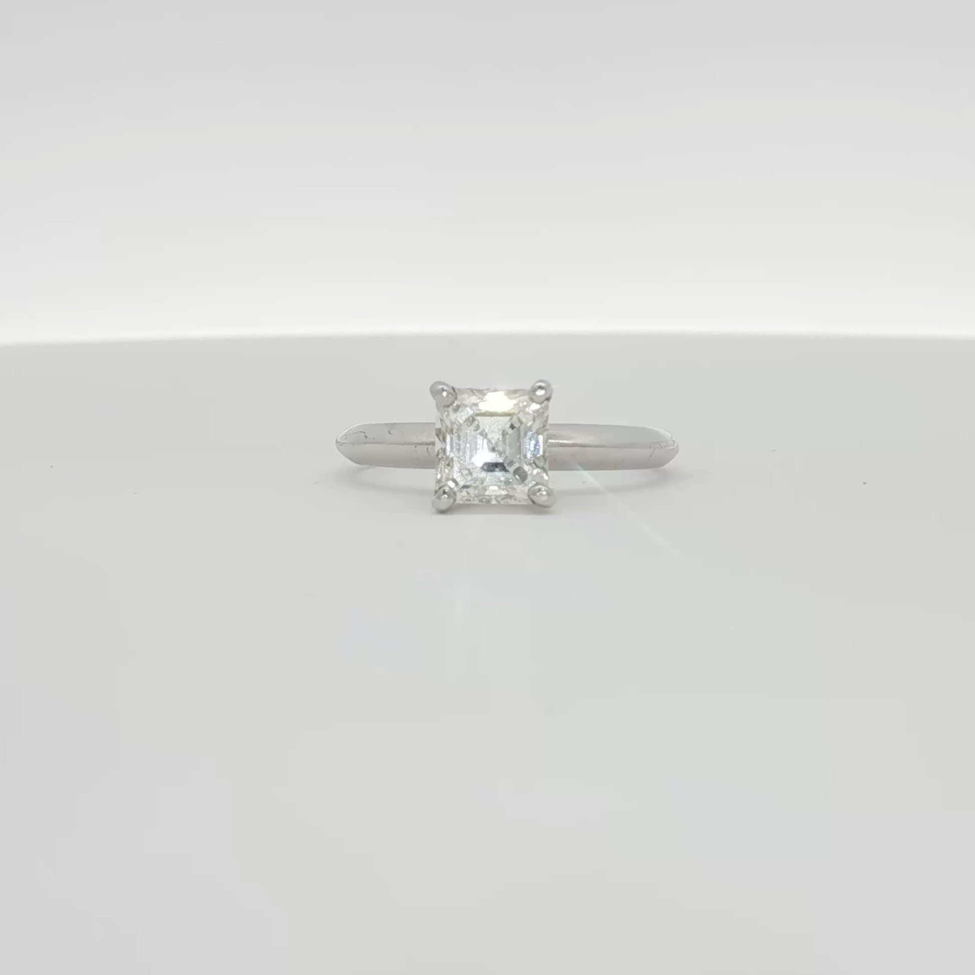 14K white gold diamond solitaire engagement ring with a round-cut diamond from Gold & Beyond, showcasing elegant jewelry craftsmanship.