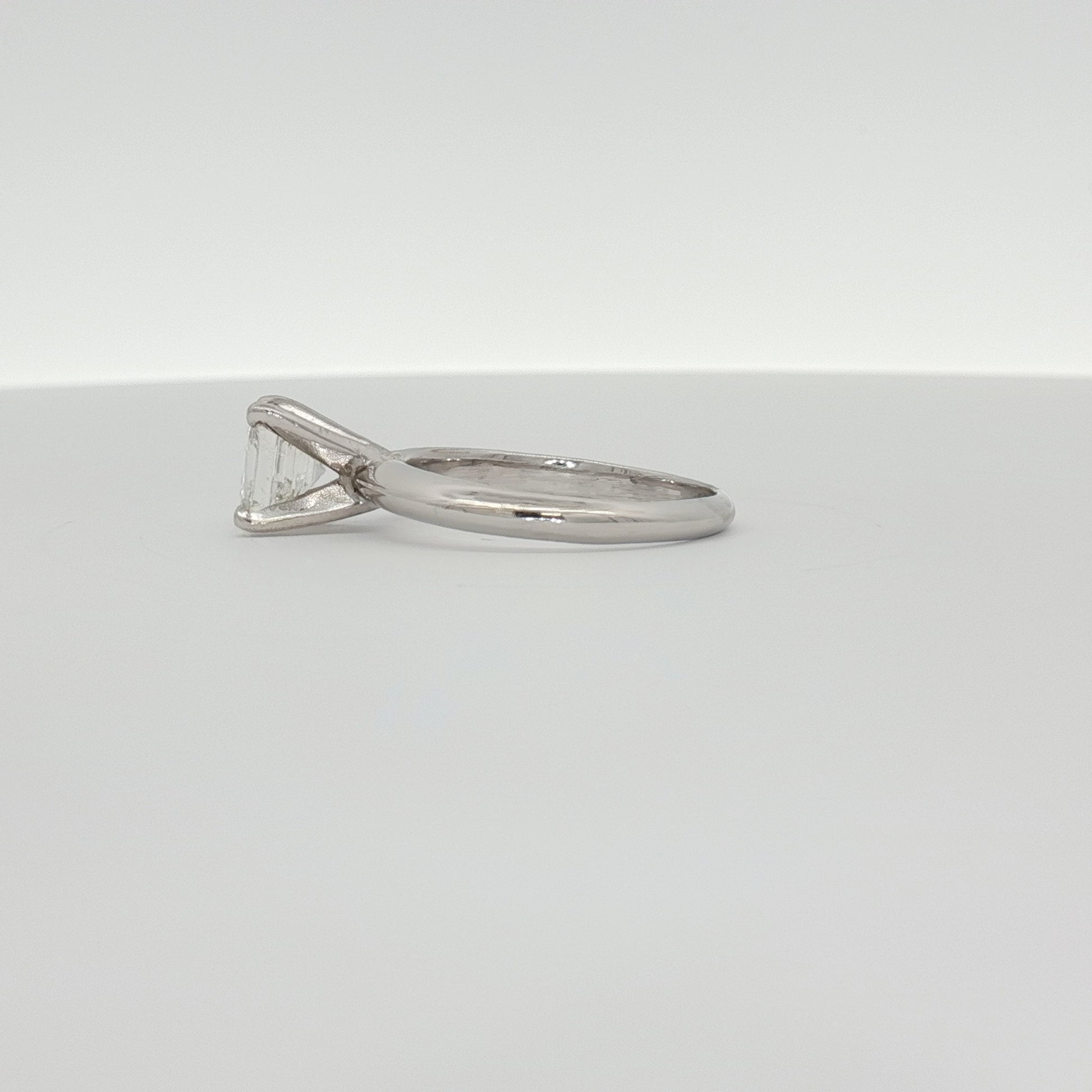 14K white gold diamond solitaire engagement ring with a round center stone, crafted by Gold & Beyond.