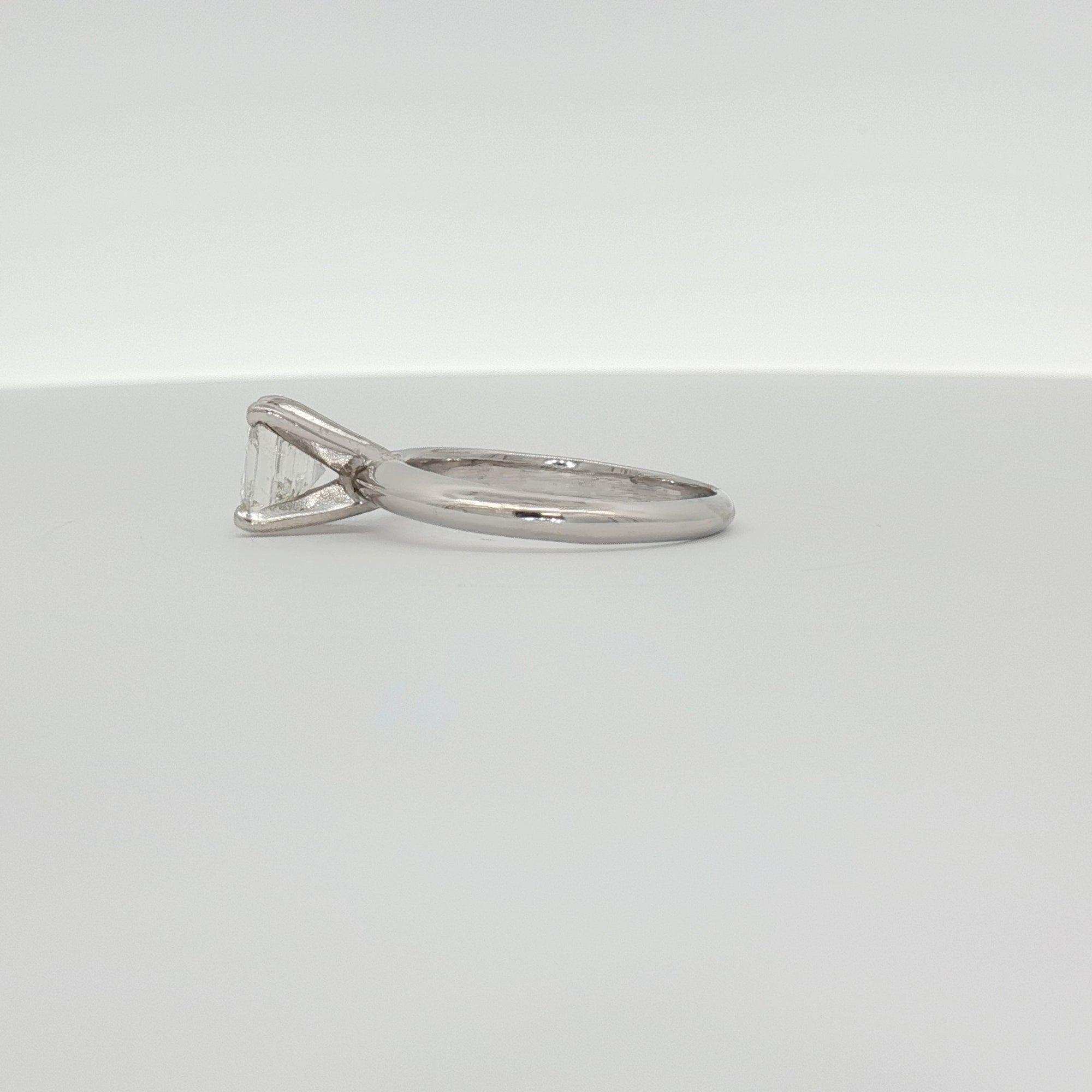 14K white gold diamond solitaire engagement ring with a round center stone, crafted by Gold & Beyond.