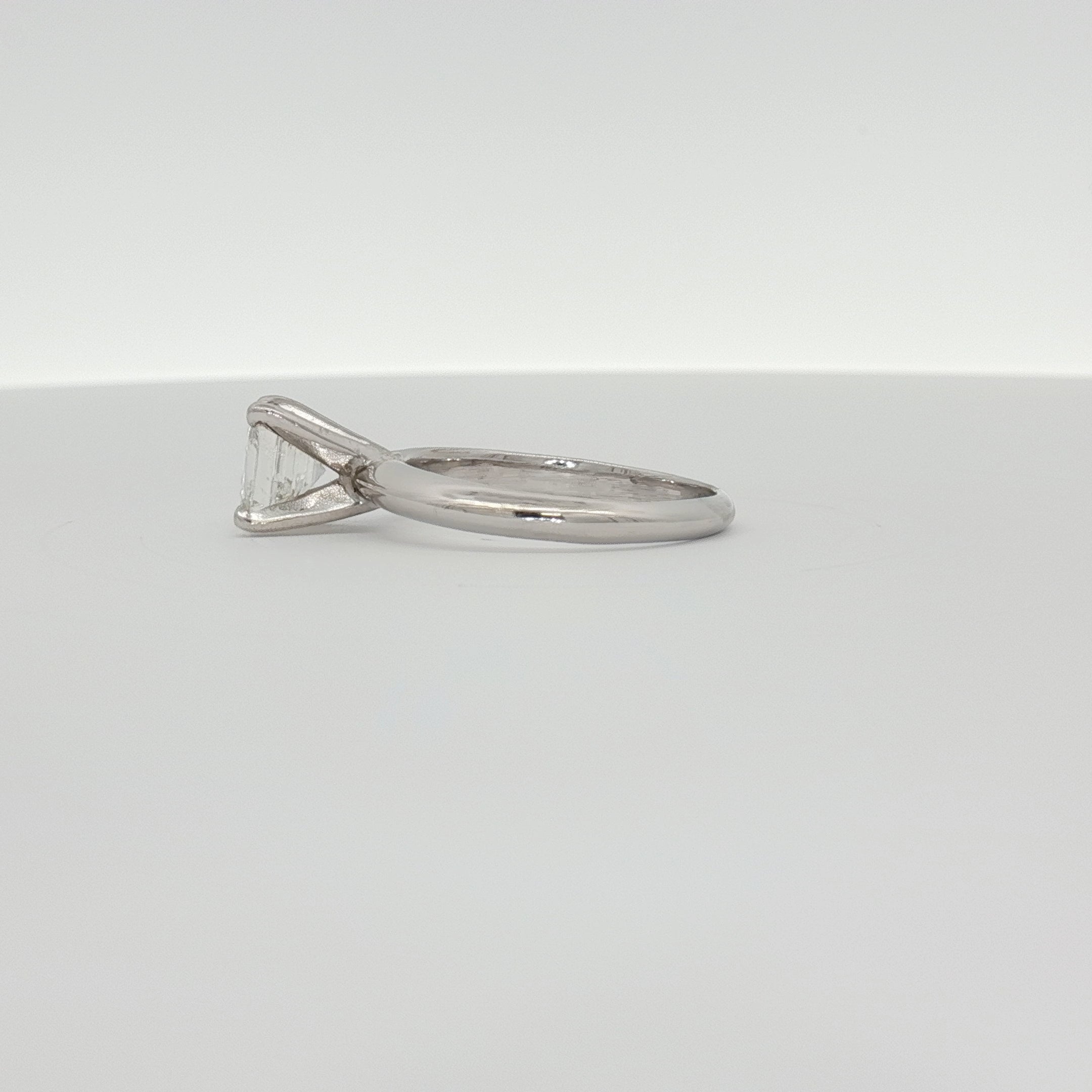 14K white gold diamond solitaire engagement ring with a round center stone, crafted by Gold & Beyond.
