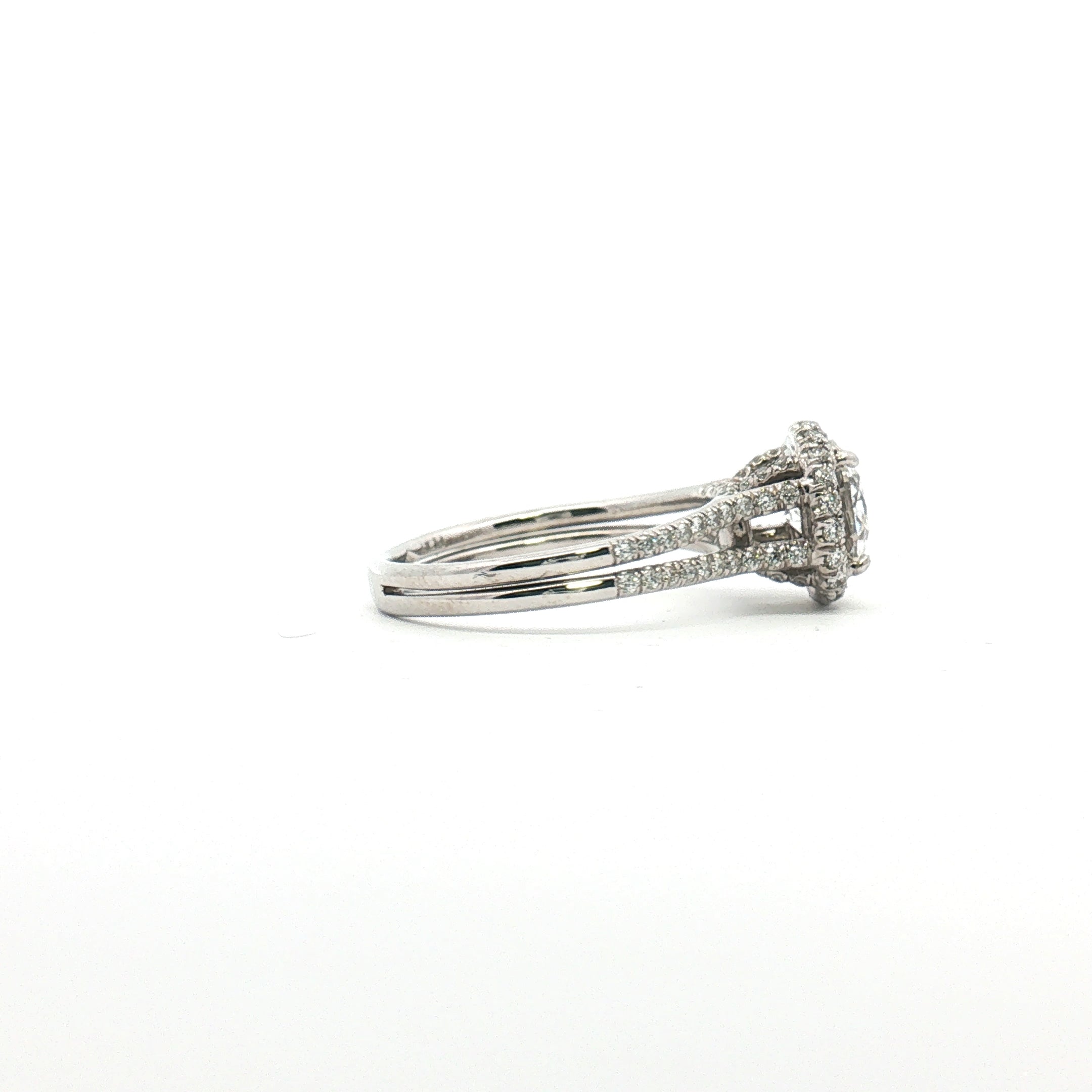 Platinum diamond halo ring with sparkling diamonds and intricate design, crafted by Gold & Beyond.
