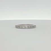 14K white gold diamond wedding band from Gold & Beyond featuring sparkling diamonds and a sleek, polished finish.