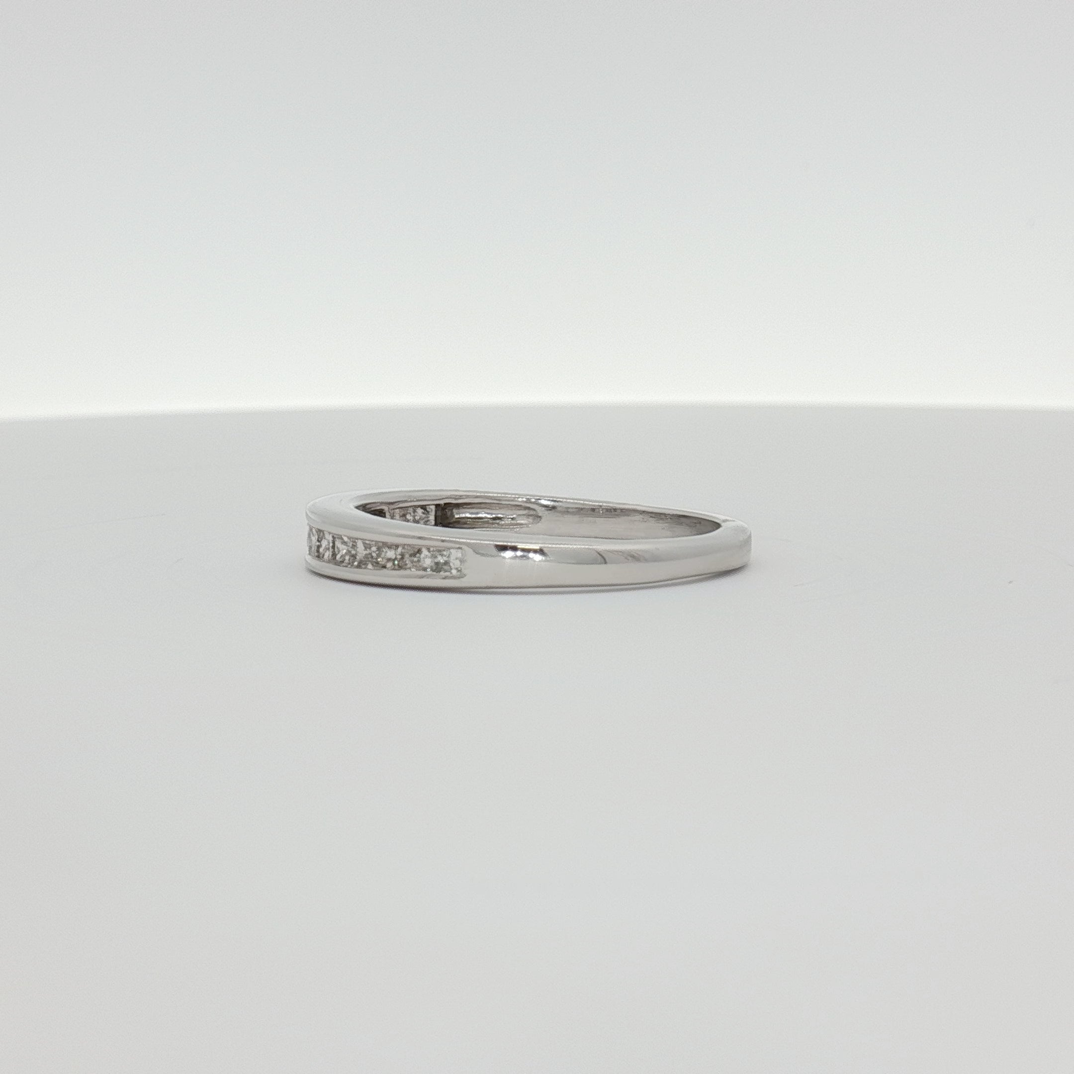 14K white gold diamond wedding band with sparkling diamonds, elegant jewelry piece from Gold & Beyond.