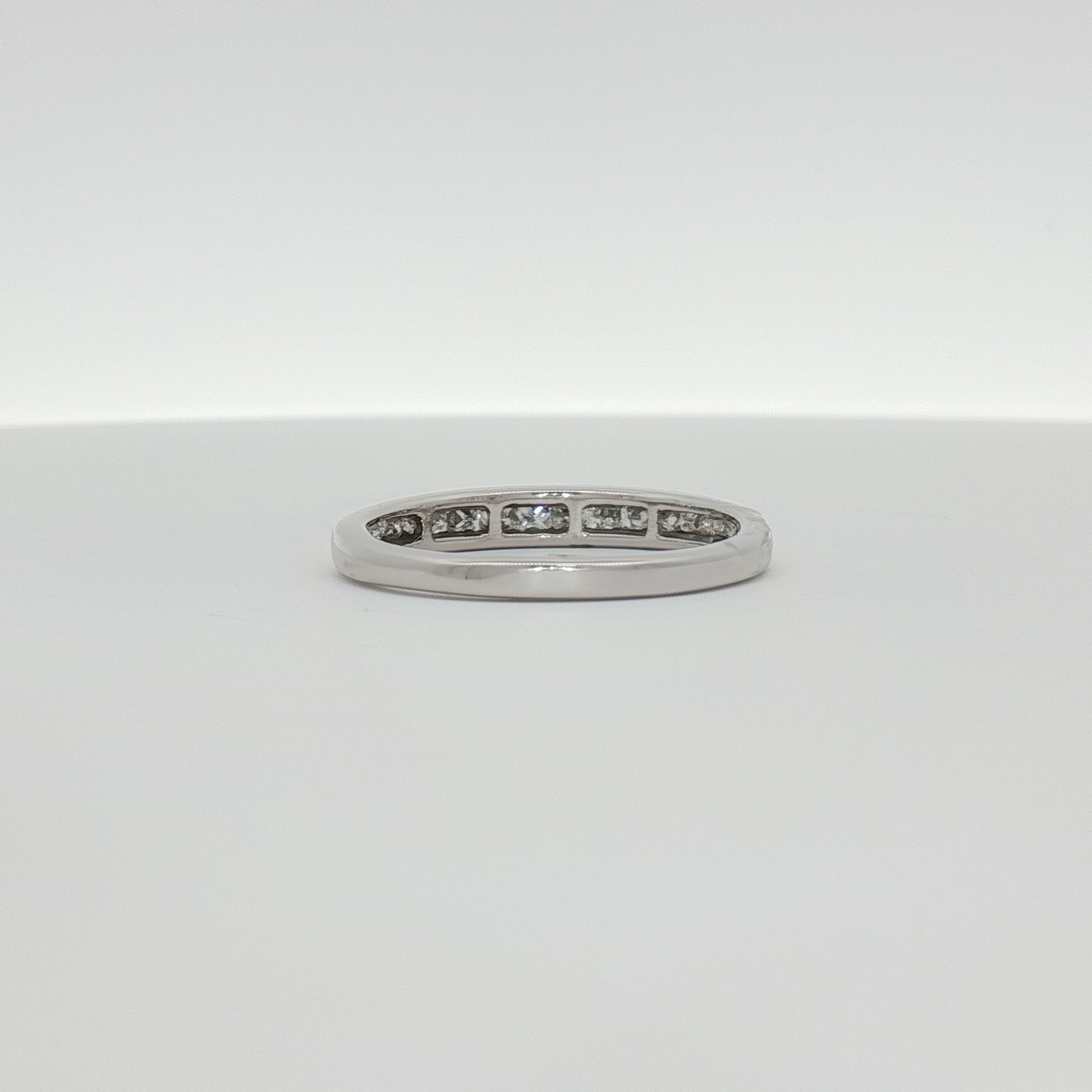 14K white gold diamond wedding band jewelry with sparkling diamonds, showcasing elegant craftsmanship and a polished finish.