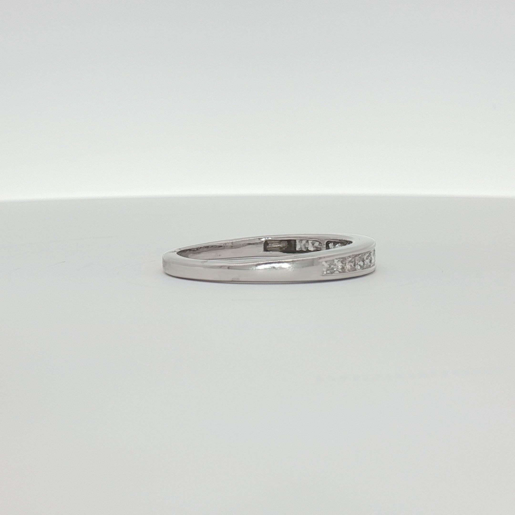 14K white gold diamond wedding band featuring sparkling diamonds, crafted by Gold & Beyond in elegant jewelry design.