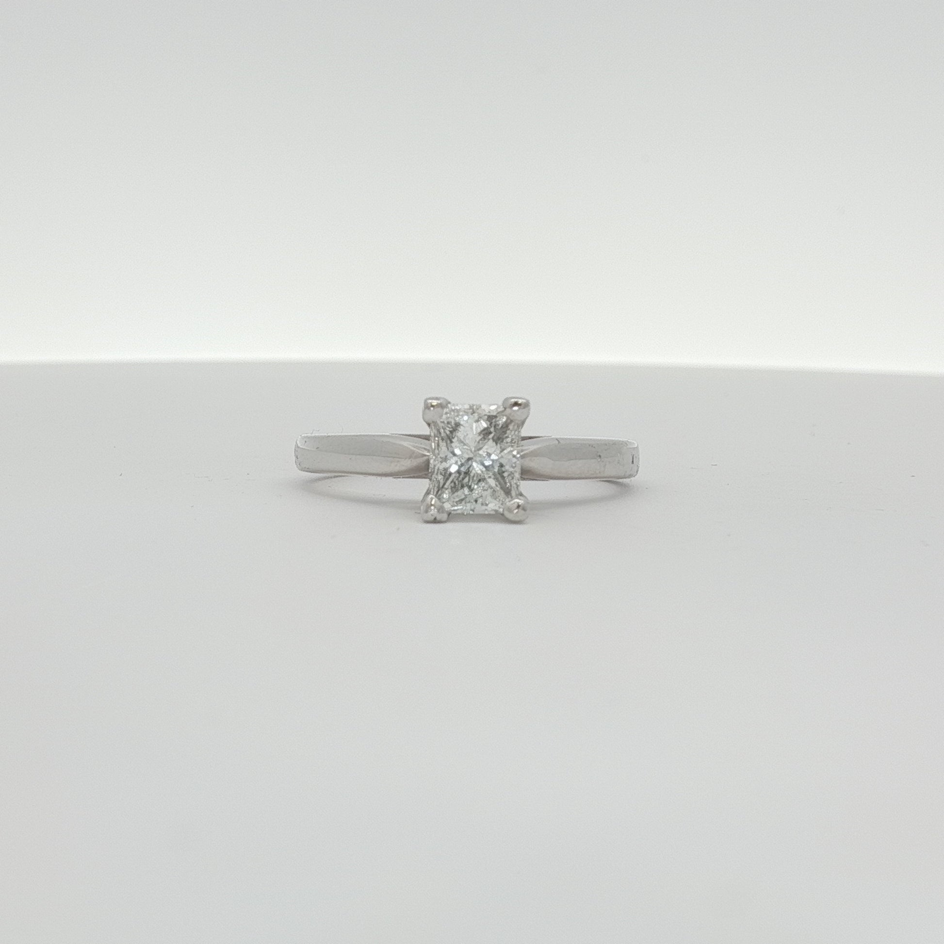 14K white gold diamond solitaire engagement ring with a round center diamond, crafted by Gold & Beyond.