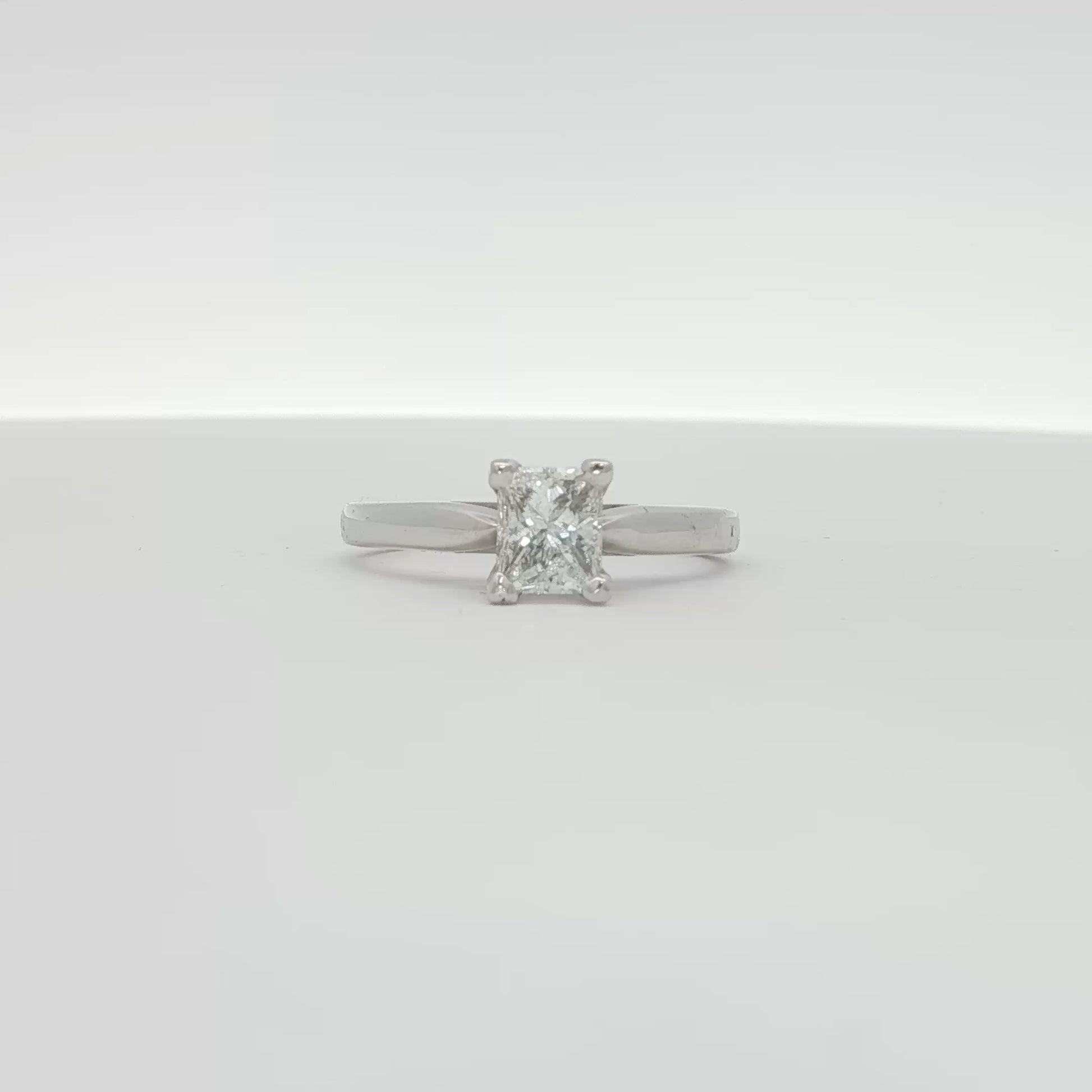 14K white gold diamond solitaire engagement ring with a single sparkling diamond, featuring a classic jewelry design.