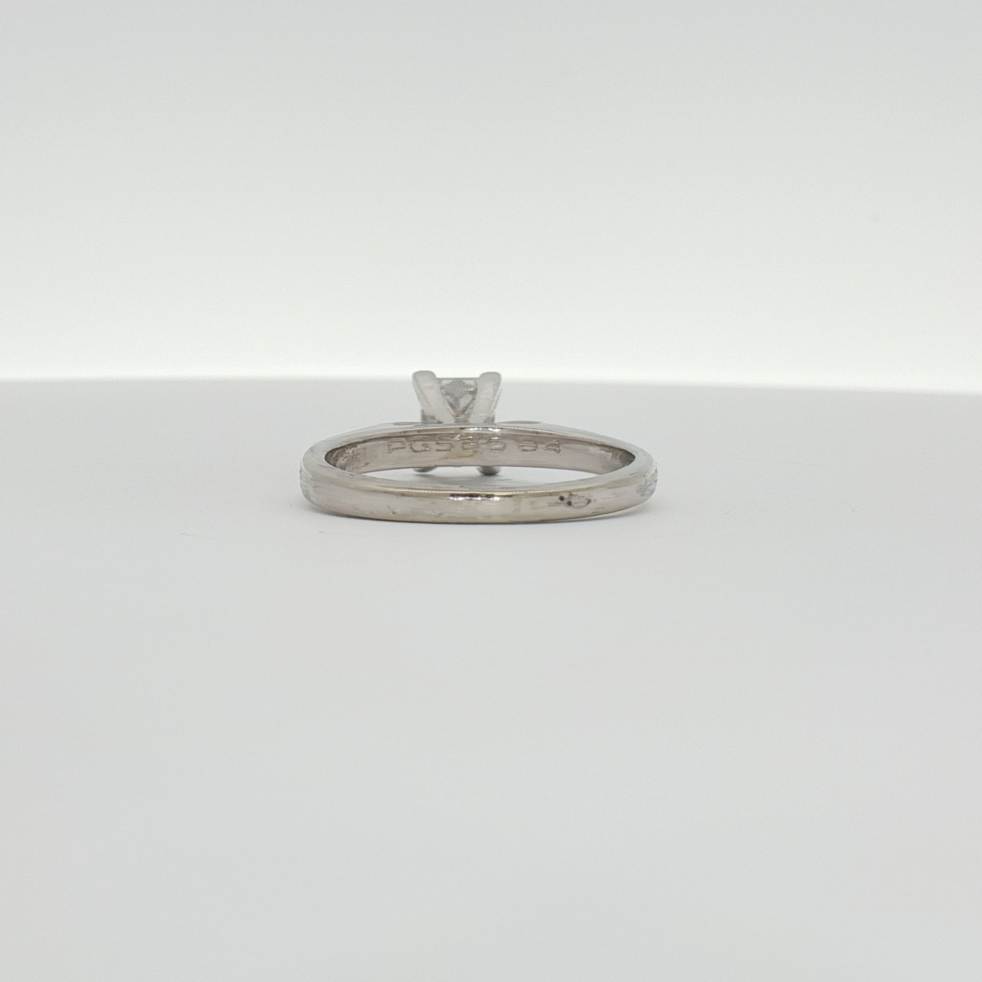 14K white gold diamond solitaire engagement ring with a central round brilliant diamond, crafted by Gold & Beyond.