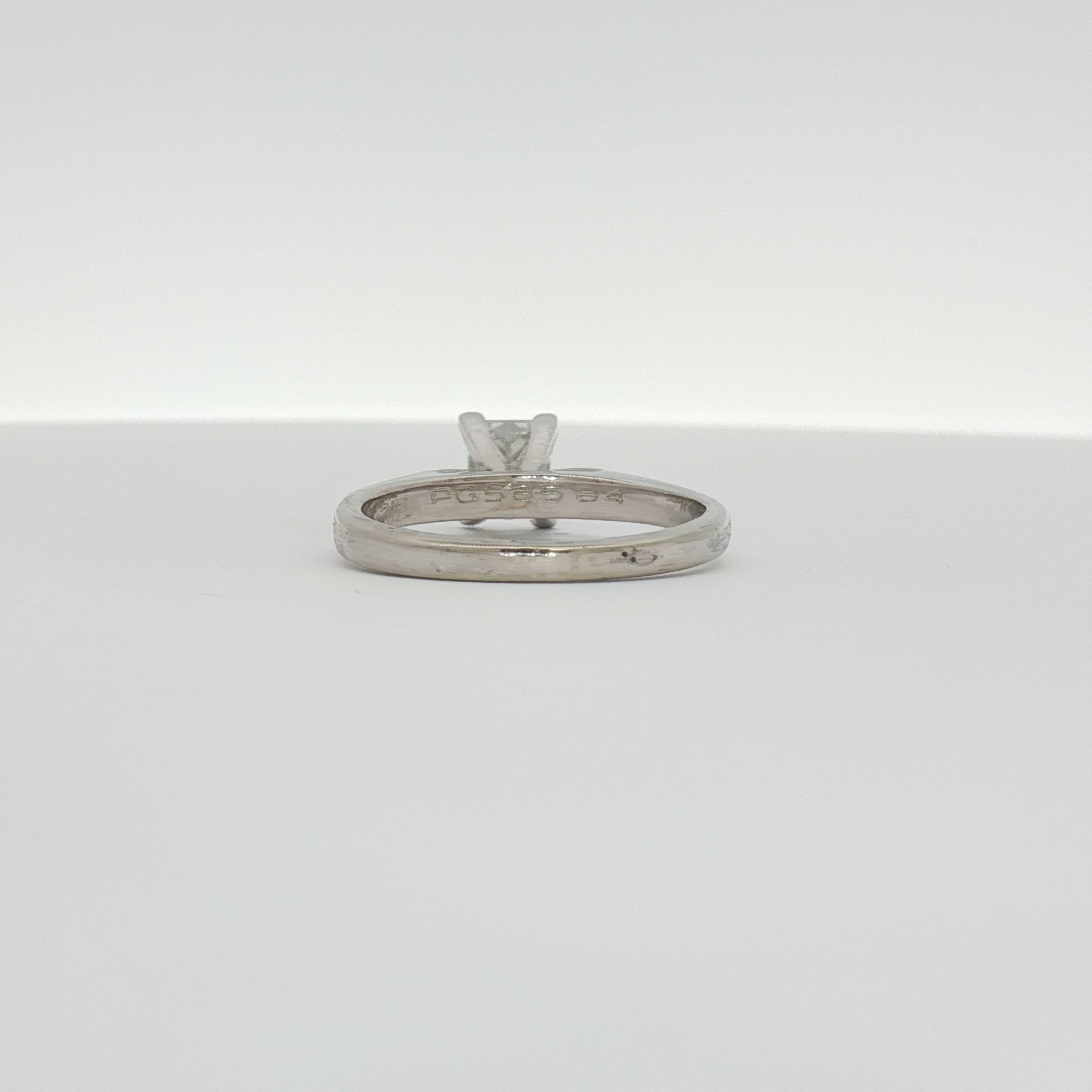 14K white gold diamond solitaire engagement ring with a central round brilliant diamond, crafted by Gold & Beyond.