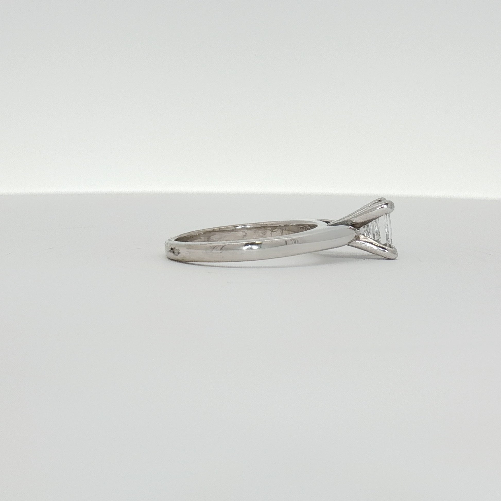 14K white gold diamond solitaire engagement ring featuring a sparkling central diamond and a sleek, elegant band from Gold & Beyond.