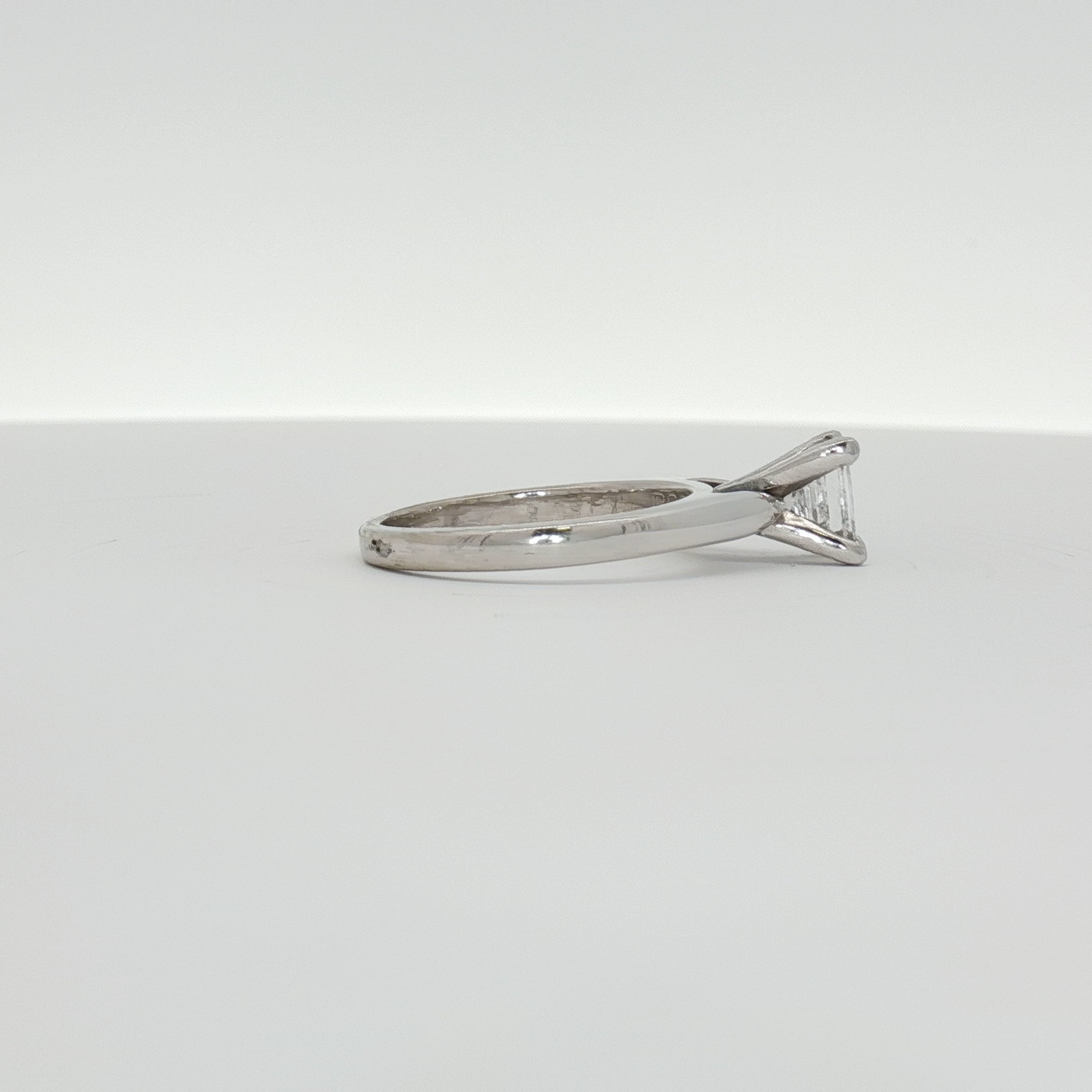 14K white gold diamond solitaire engagement ring featuring a sparkling central diamond and a sleek, elegant band from Gold & Beyond.
