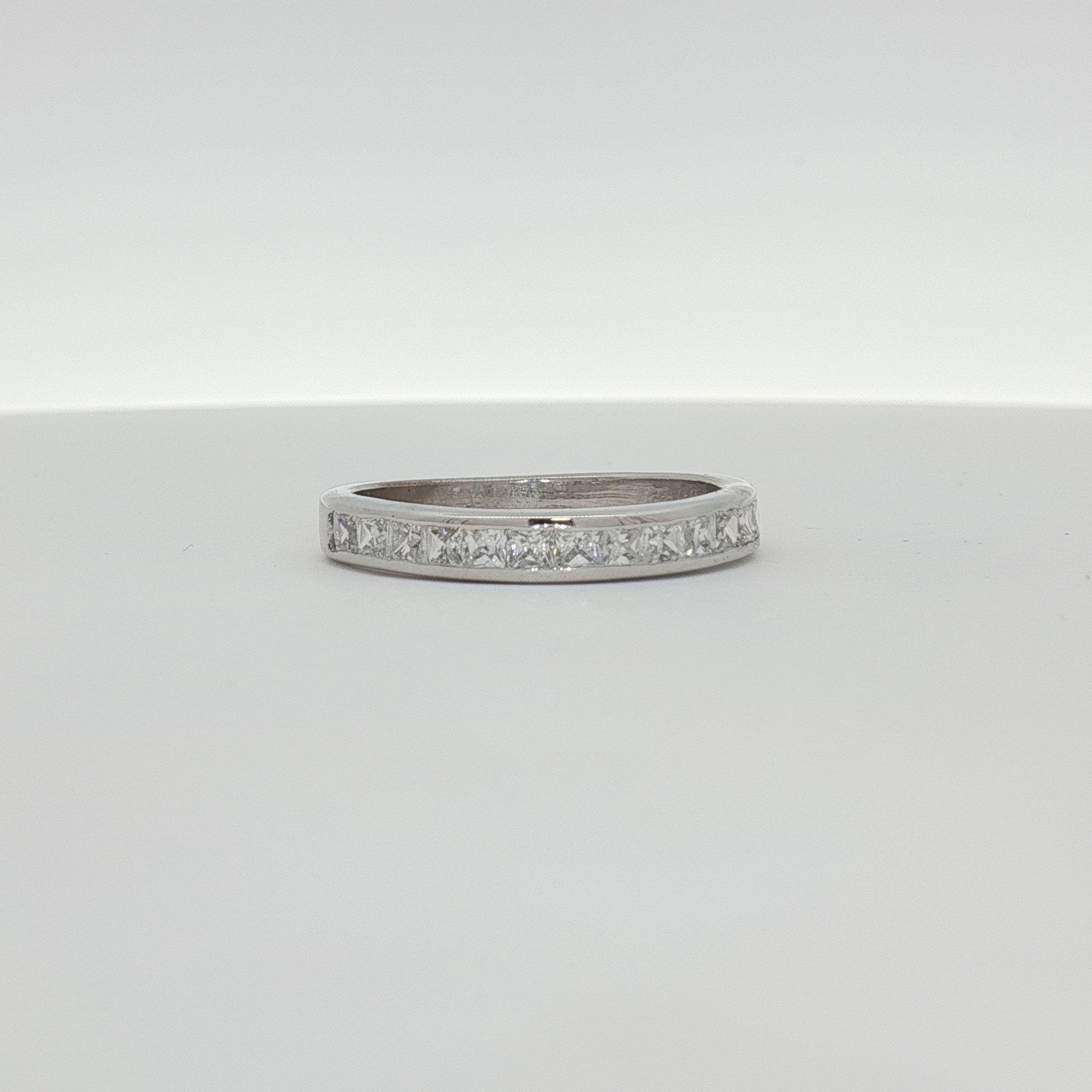 10K white gold diamond wedding band with sparkling diamonds, crafted by Gold & Beyond, showcasing elegant jewelry design.