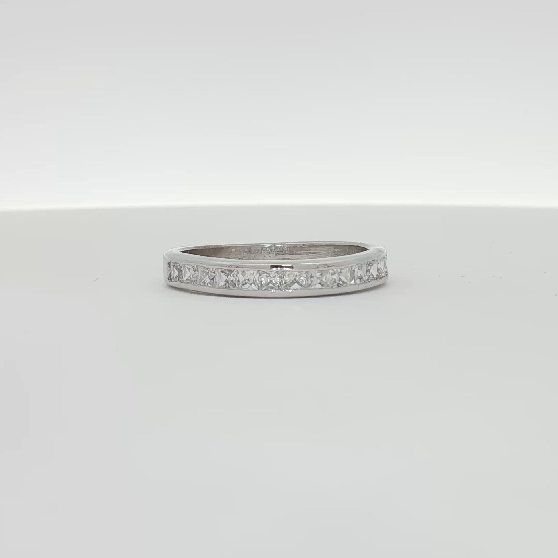 Elegant 10K white gold diamond wedding band featuring sparkling diamonds and a polished finish from Gold & Beyond jewelry collection.