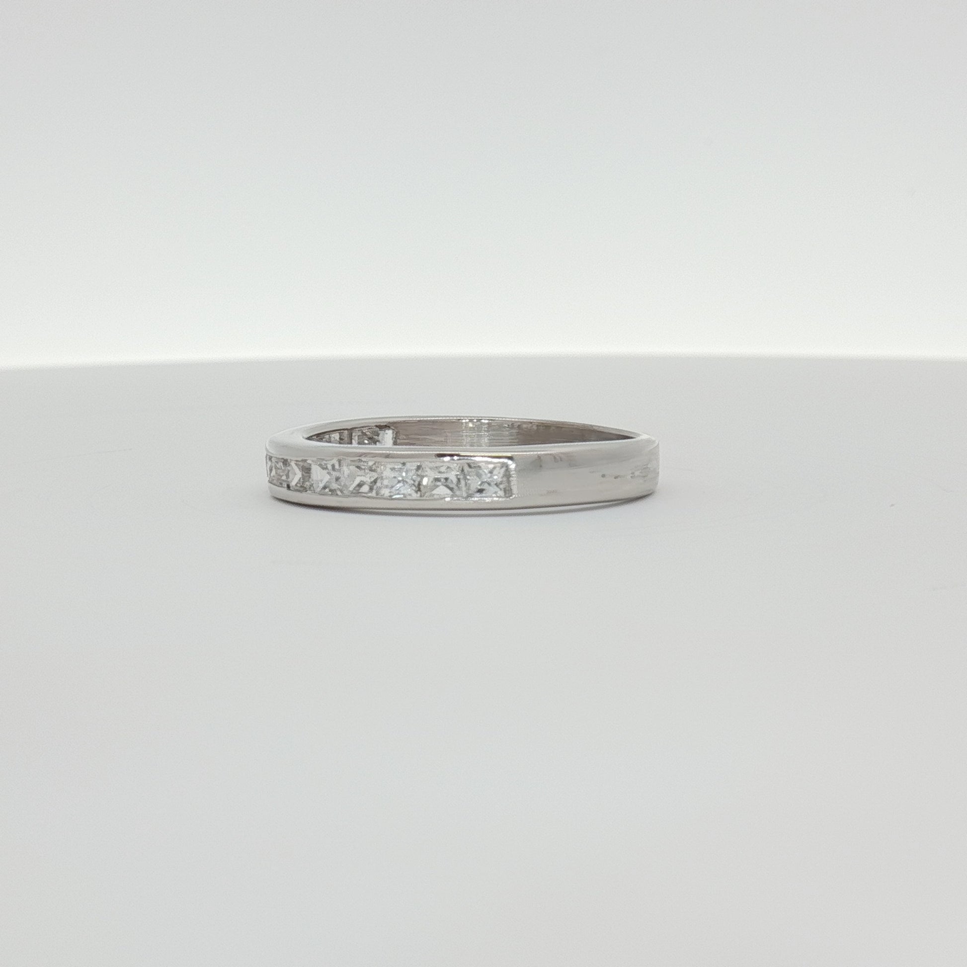 10K white gold diamond wedding band with sparkling diamonds, showcasing elegant jewelry design from Gold & Beyond.