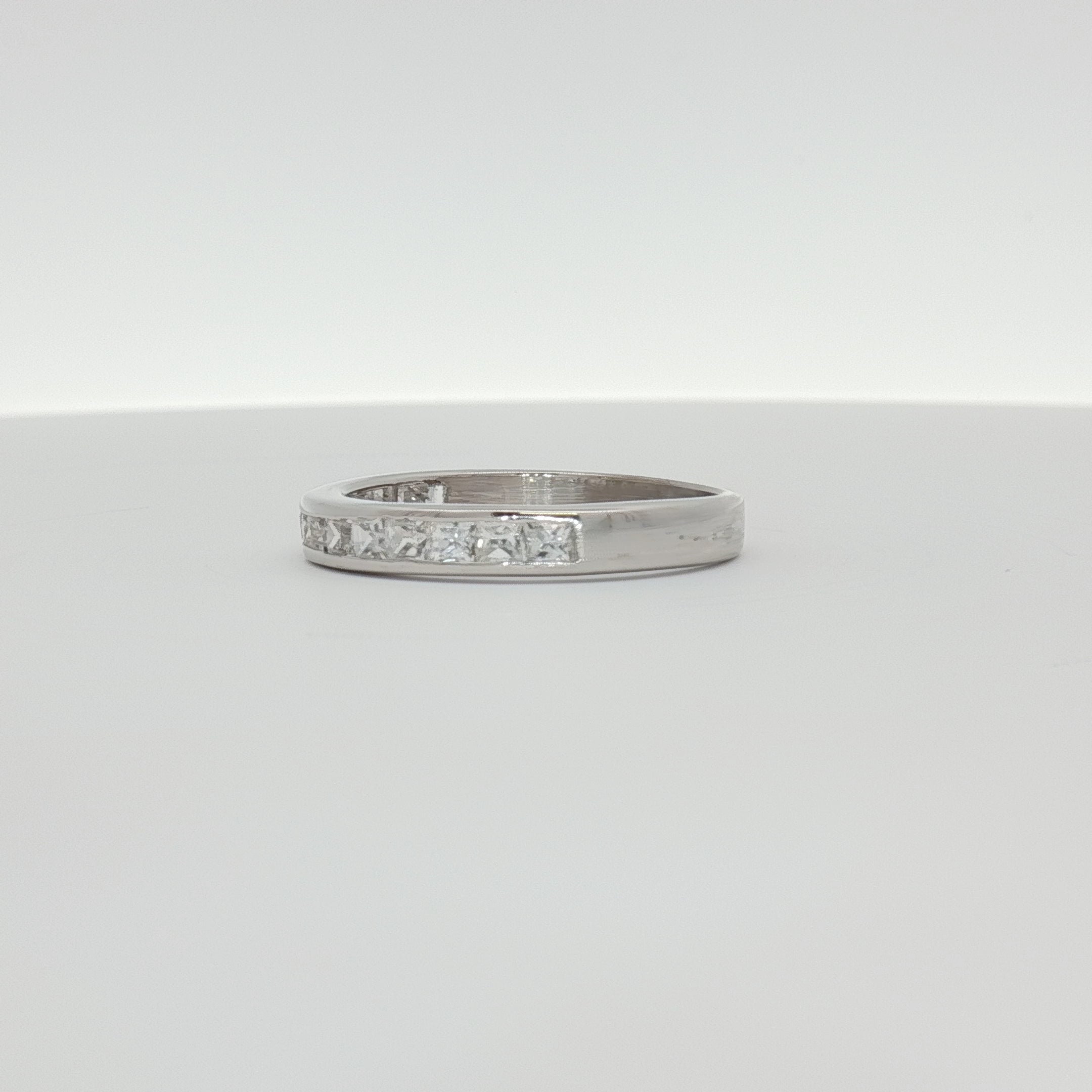 10K white gold diamond wedding band with sparkling diamonds, showcasing elegant jewelry design from Gold & Beyond.