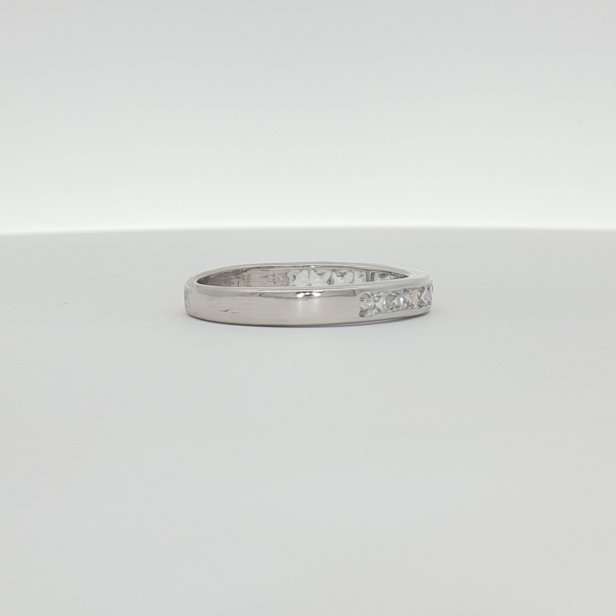 Elegant 10K white gold diamond wedding band featuring sparkling diamonds and a sleek design from Gold & Beyond jewelry collection.