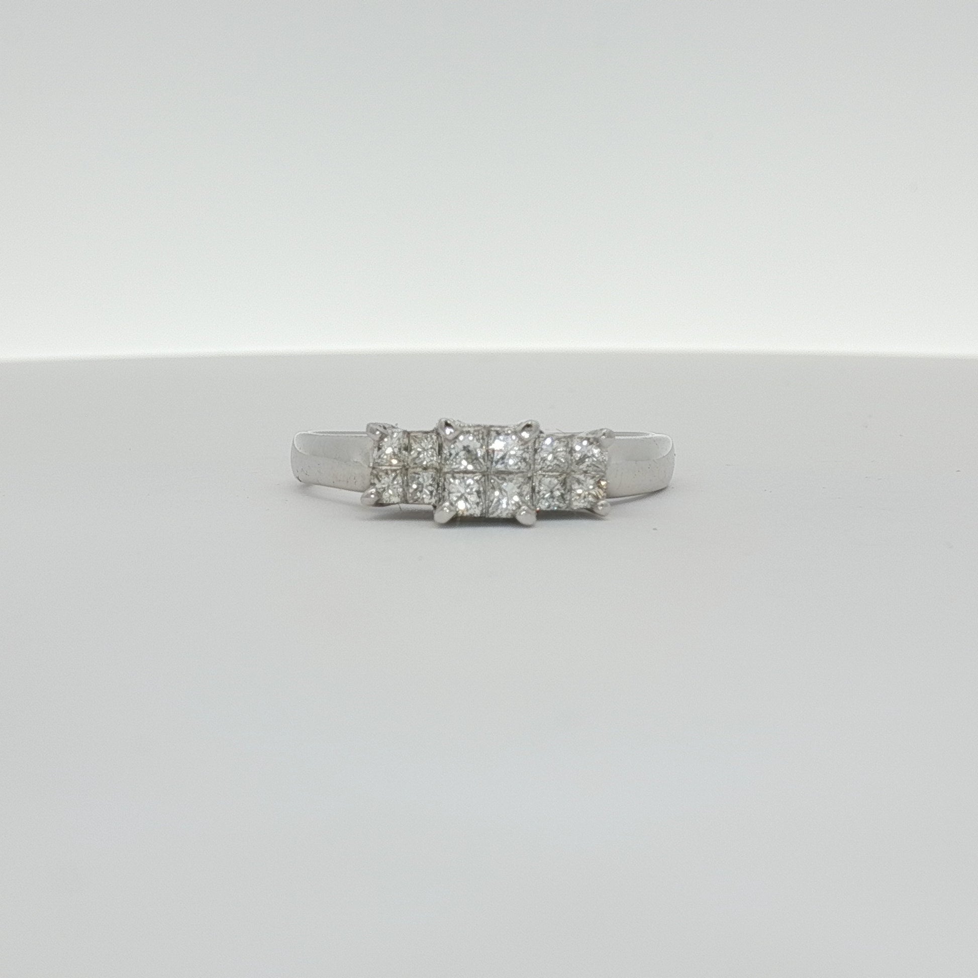 14K white gold diamond engagement ring with a sparkling center stone and side accents, crafted by Gold & Beyond.