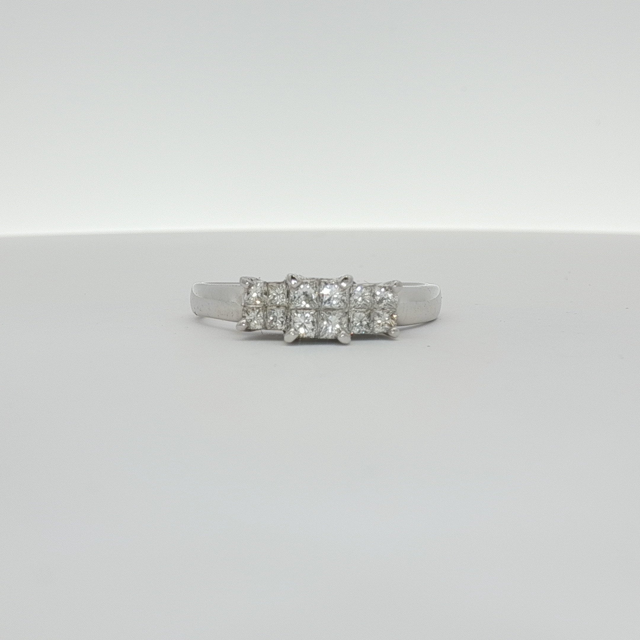 14K white gold diamond engagement ring with a sparkling center stone and side accents, crafted by Gold & Beyond.