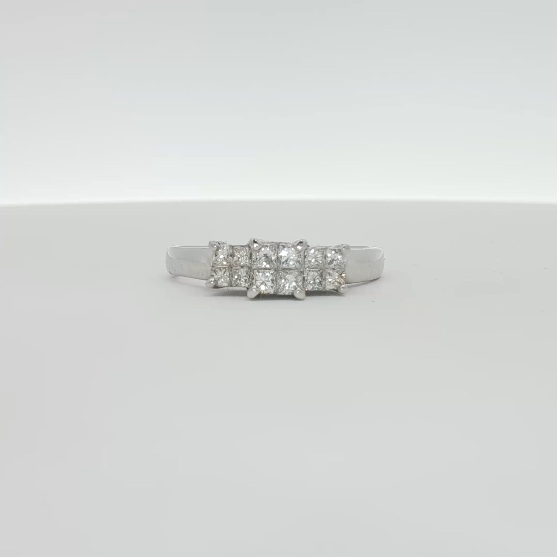 14K white gold diamond engagement ring with a central sparkling diamond and intricate band design, from Gold & Beyond Jewelry.