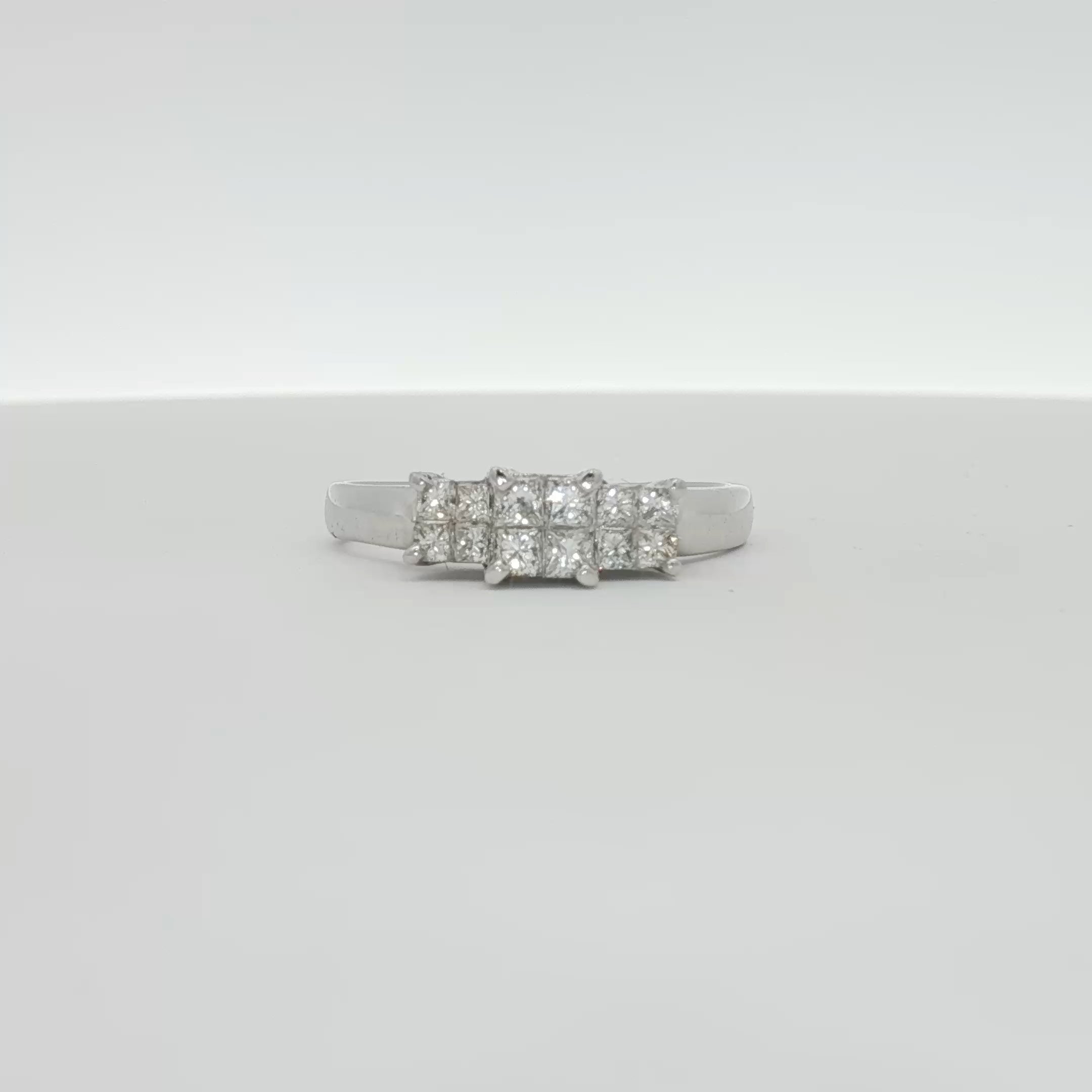 14K white gold diamond engagement ring with a central sparkling diamond and intricate band design, from Gold & Beyond Jewelry.