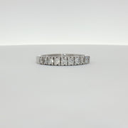 14K white gold diamond wedding band from Gold & Beyond with sparkling diamonds and smooth polished finish.