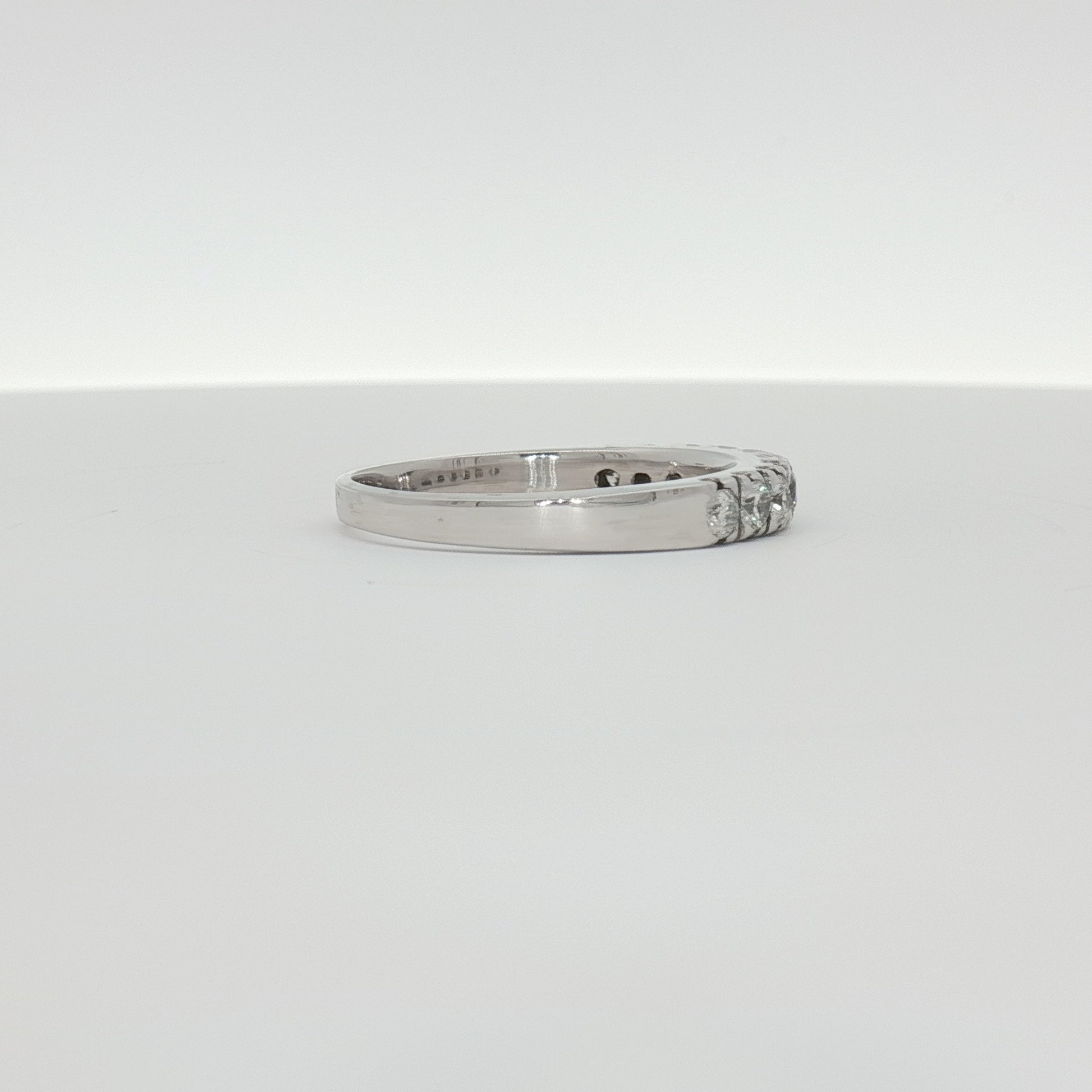 14K white gold diamond wedding band with sparkling diamonds, elegant jewelry piece from Gold & Beyond.